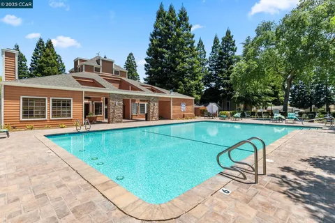 a view of a swimming pool with a patio