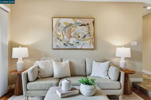 a living room with furniture a lamp and a couch