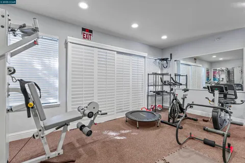 a view of a backyard with swimming pool