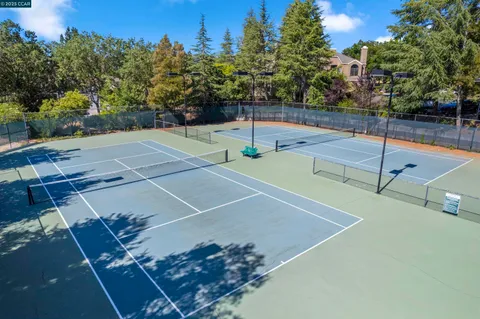 a view of swimming pool with a patio