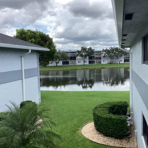 a view of a lake with a house in the background