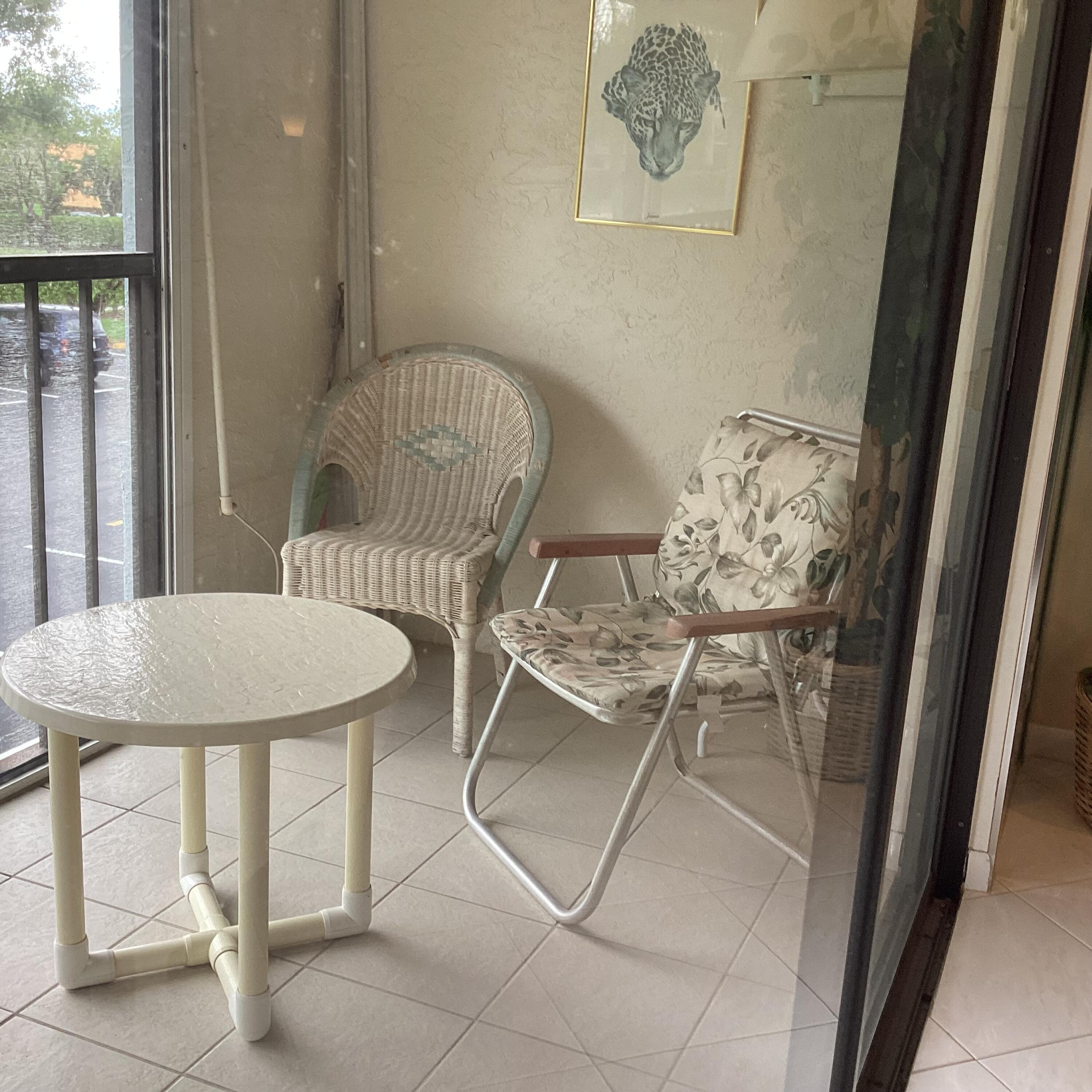 15235 Lakes Of Delray Boulevard, Unit 303 Delray Beach, FL 33484 - Photo 21 of 24 a view of a dining room with furniture and a window