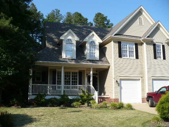 2413 Carruthers Court Raleigh, NC 27615 - Photo 1 of 7 a front view of a house with a yard