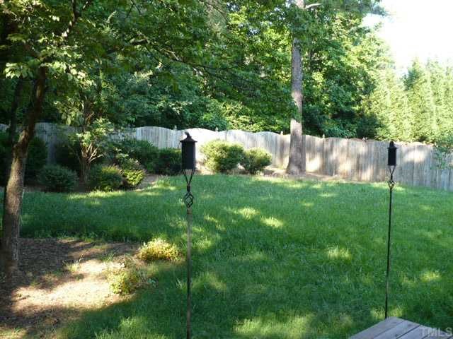 2413 Carruthers Court Raleigh, NC 27615 - Photo 3 of 7 a view of a garden with a tree