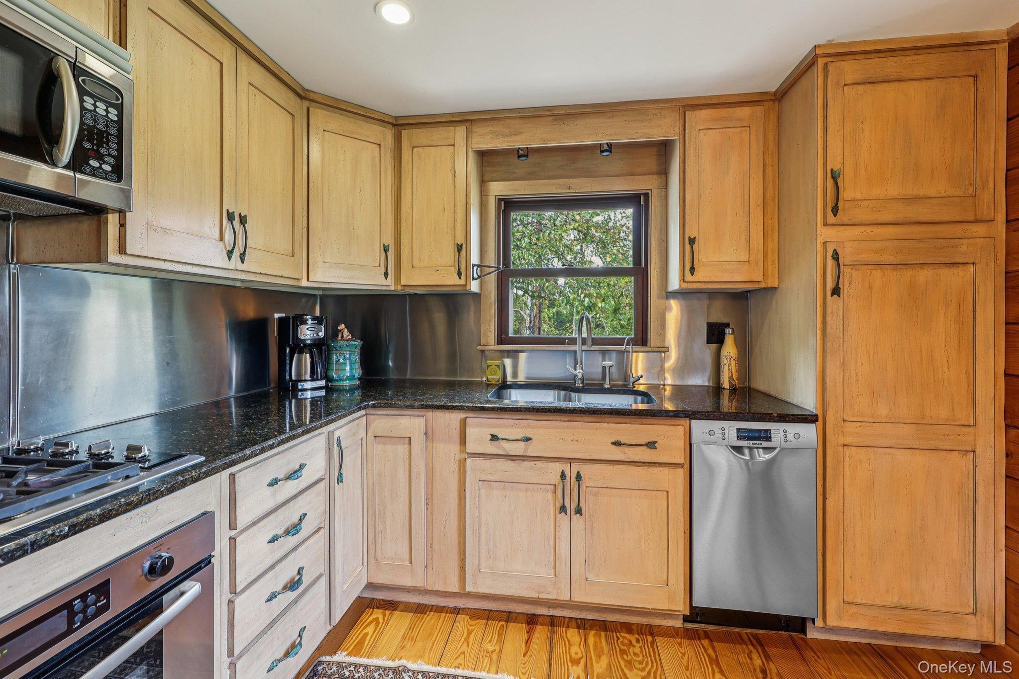 101 Upper Wisner Road Warwick, NY 10990 - Photo 12 of 48 Kitchen with appliances with stainless steel finishes, light wood-type flooring, dark stone counters, light brown cabinets, and recessed lighting