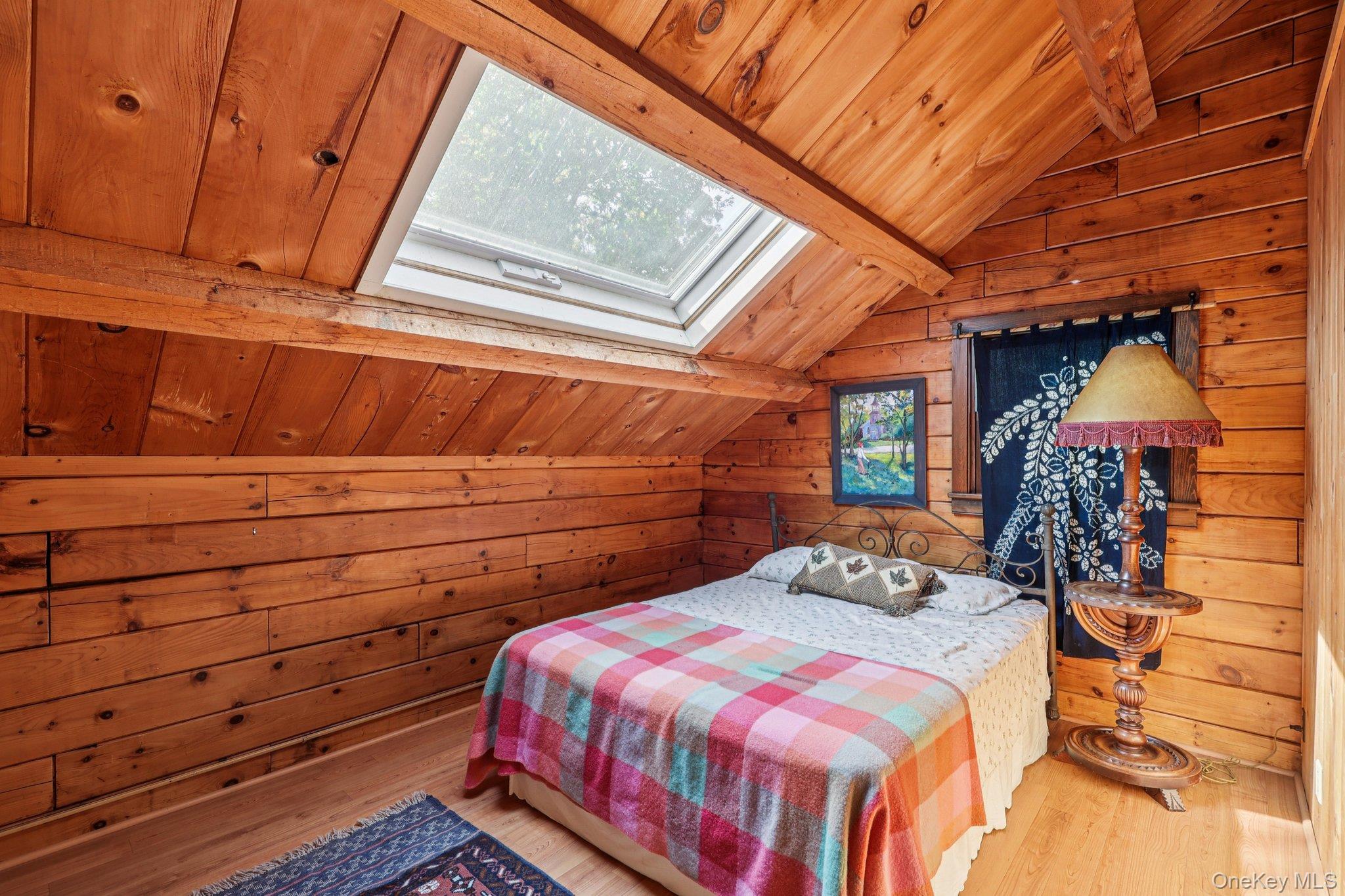 101 Upper Wisner Road Warwick, NY 10990 - Photo 15 of 48 Bedroom with wood walls, wooden ceiling, wood finished floors, and a skylight