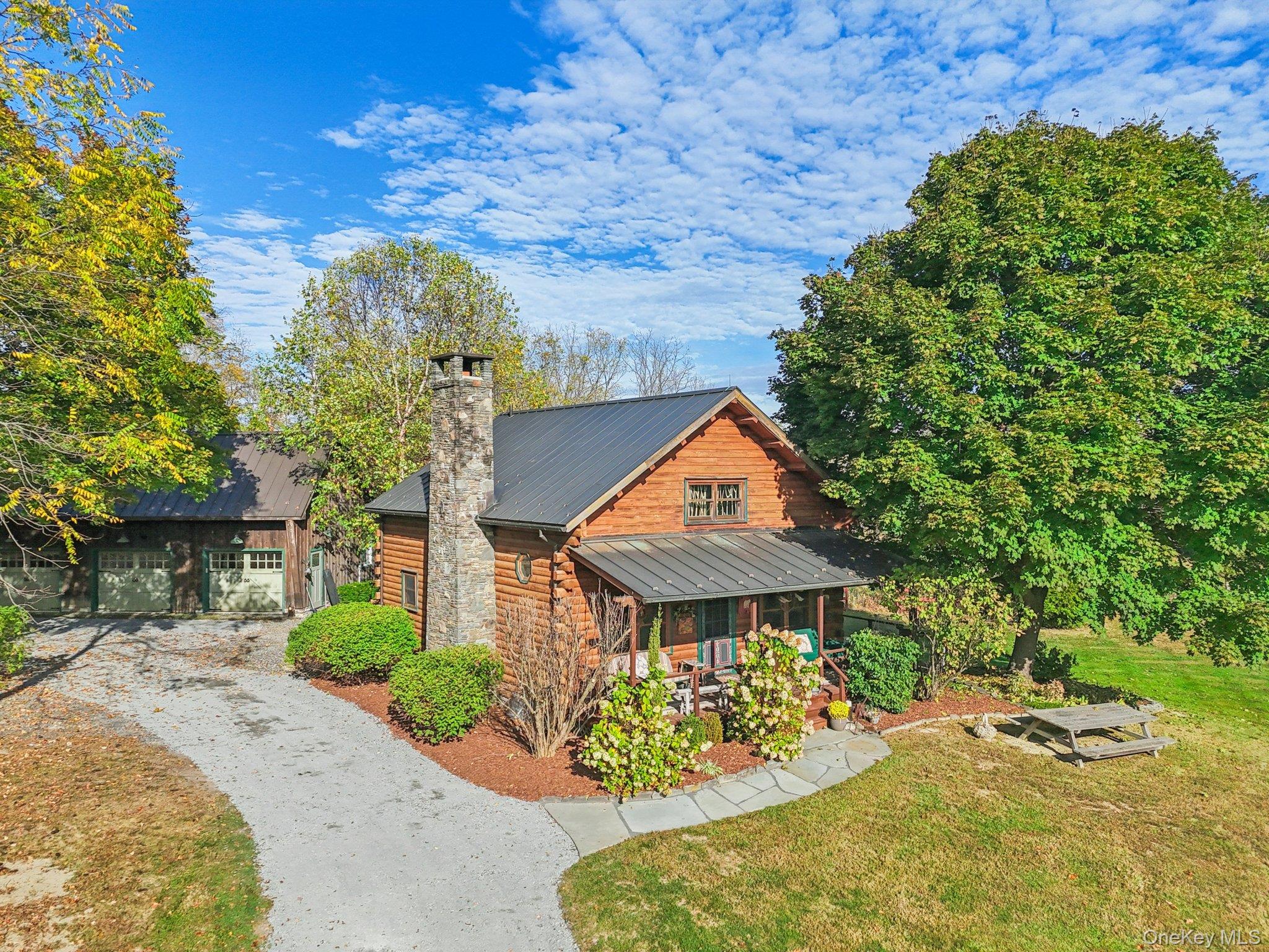101 Upper Wisner Road Warwick, NY 10990 - Photo 2 of 48 View of front of home with a metal roof, a front lawn, covered porch, a standing seam roof, and a chimney