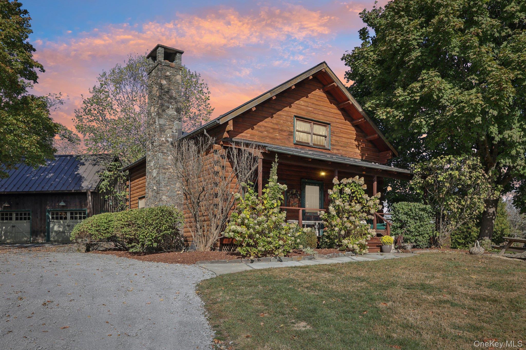 101 Upper Wisner Road Warwick, NY 10990 - Photo 43 of 48 View of front of home with covered porch, a front lawn, gravel driveway, and a chimney