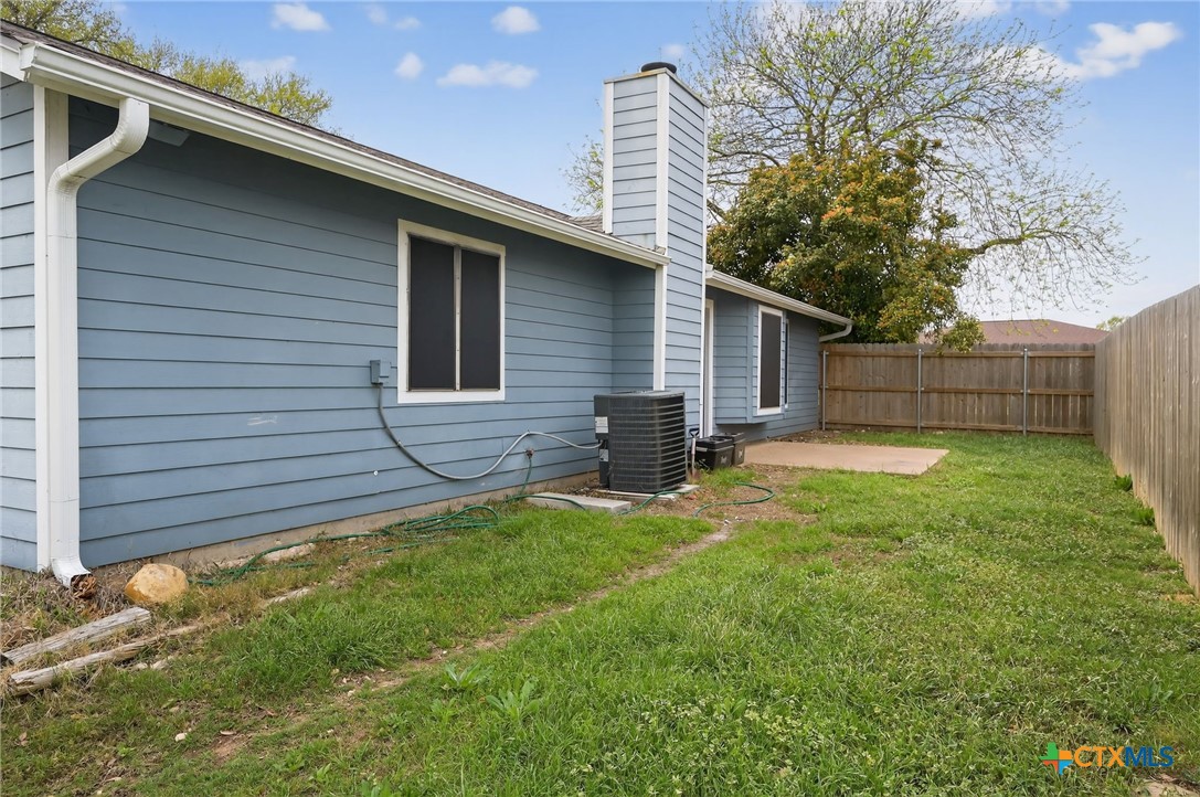 1719 Ridgeway Drive Temple, TX 76502 - Photo 27 of 28 Side yard with door that exits from front living area.