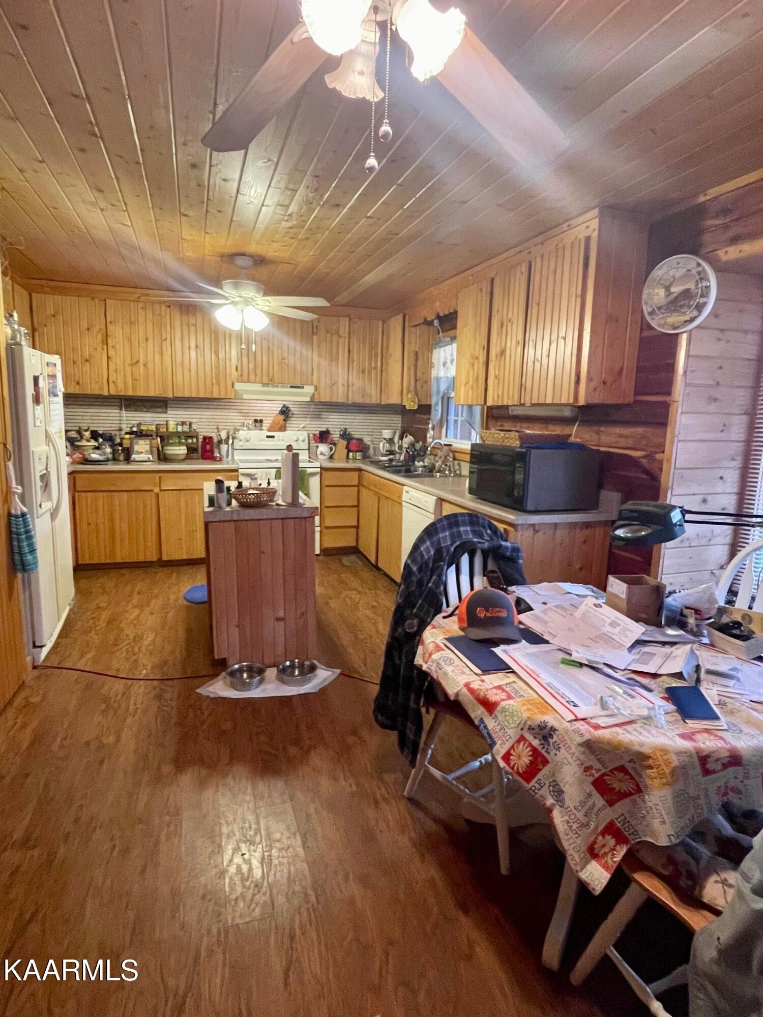 3879 Roan Creek Road Lobelville, TN 37097 - Photo 15 of 45 a bed room with furniture and kitchen view
