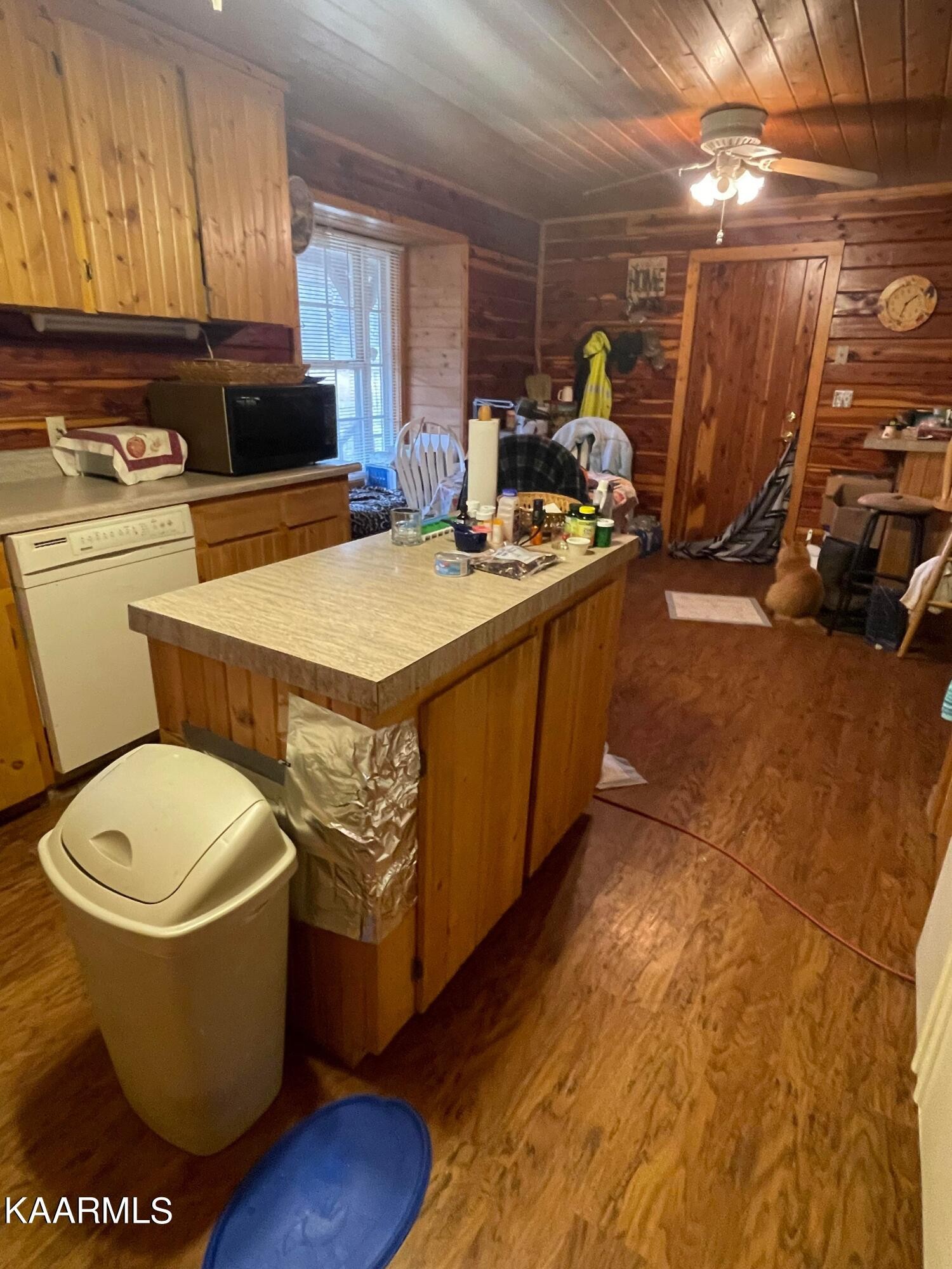 3879 Roan Creek Road Lobelville, TN 37097 - Photo 16 of 45 a room with storage and utility