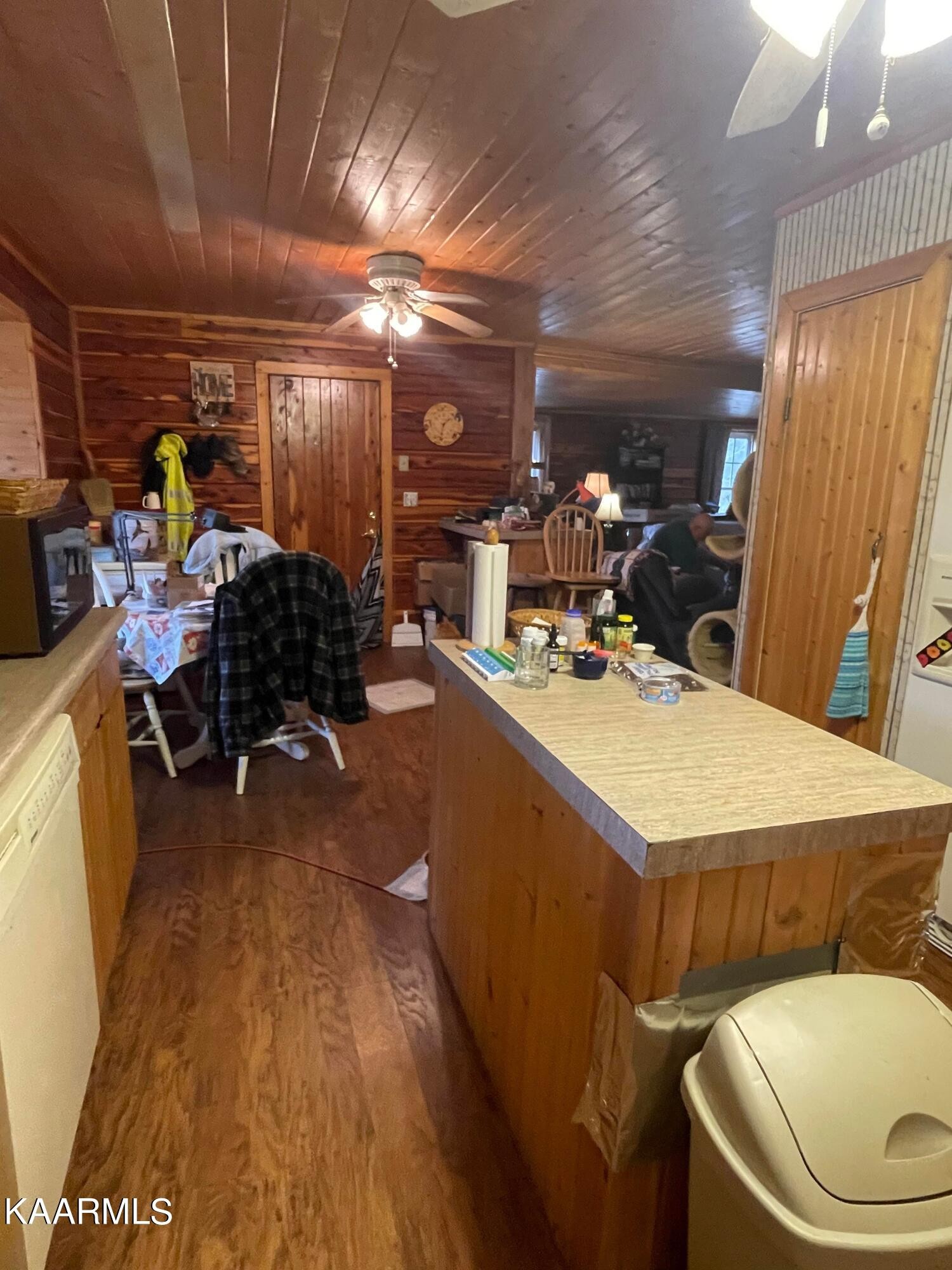 3879 Roan Creek Road Lobelville, TN 37097 - Photo 17 of 45 a room with wooden floor and furniture