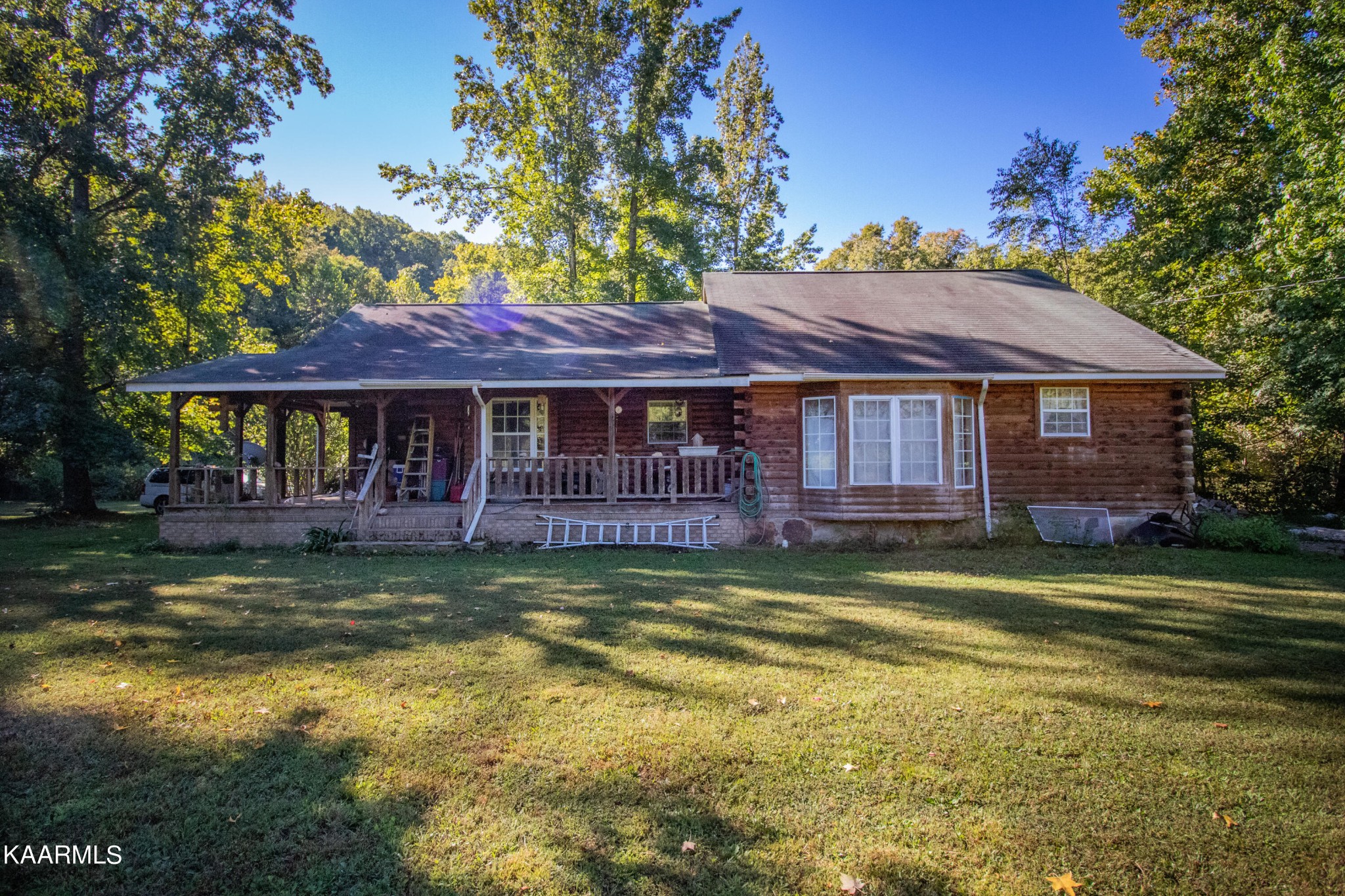 3879 Roan Creek Road Lobelville, TN 37097 - Photo 2 of 45 a view of a house with a swimming pool