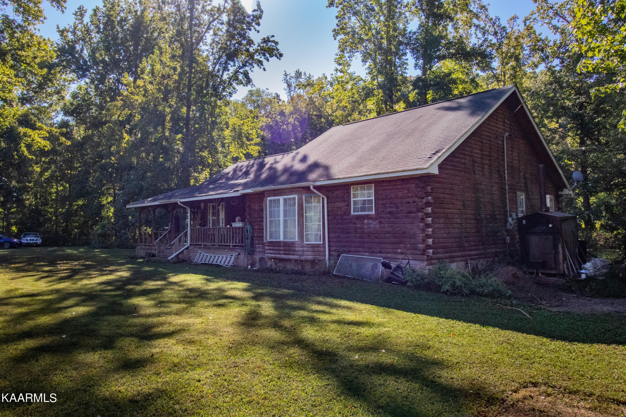 3879 Roan Creek Road Lobelville, TN 37097 - Photo 3 of 45 a view of a house with a yard