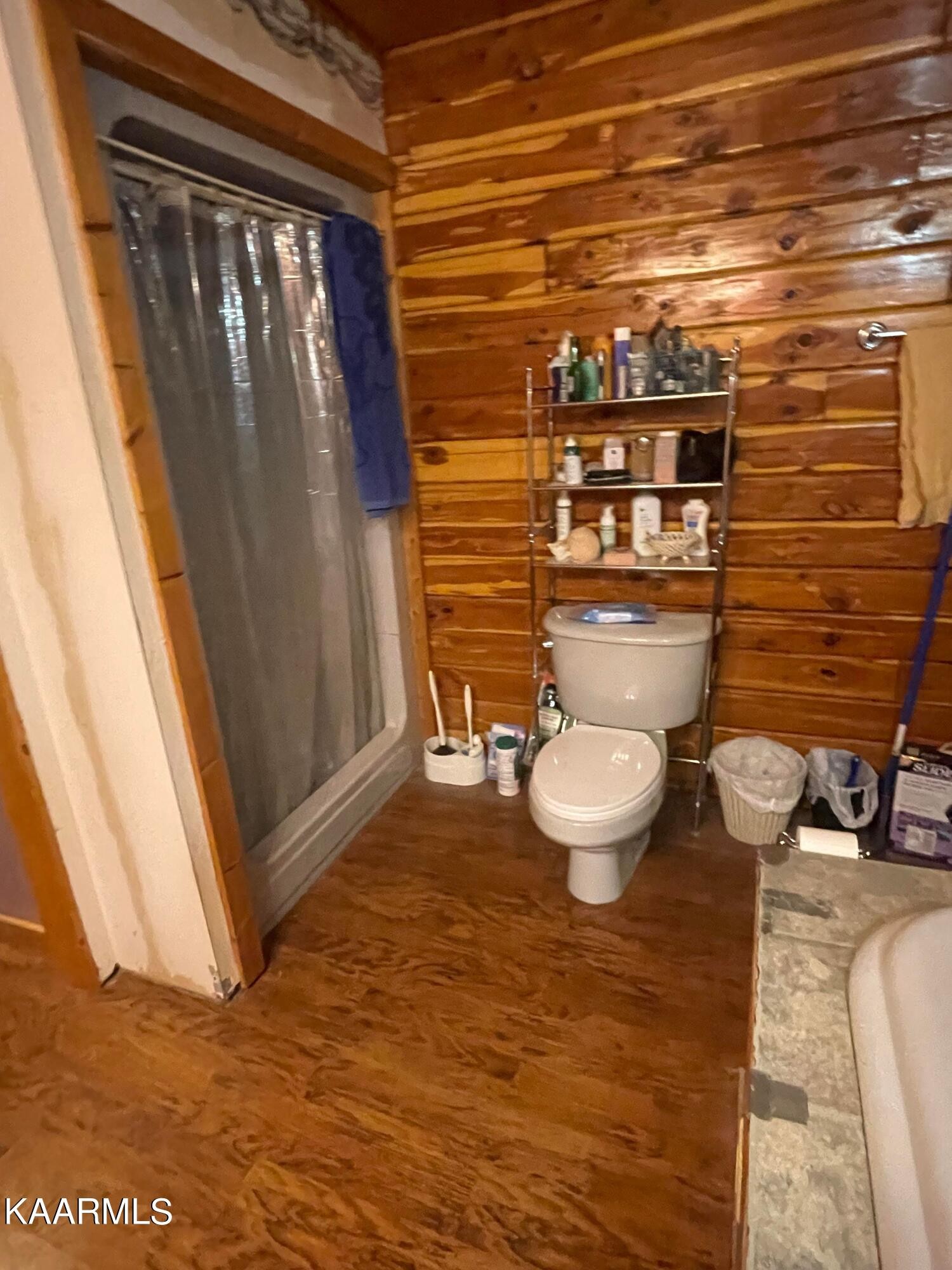 3879 Roan Creek Road Lobelville, TN 37097 - Photo 33 of 45 a bathroom with a toilet and a shower