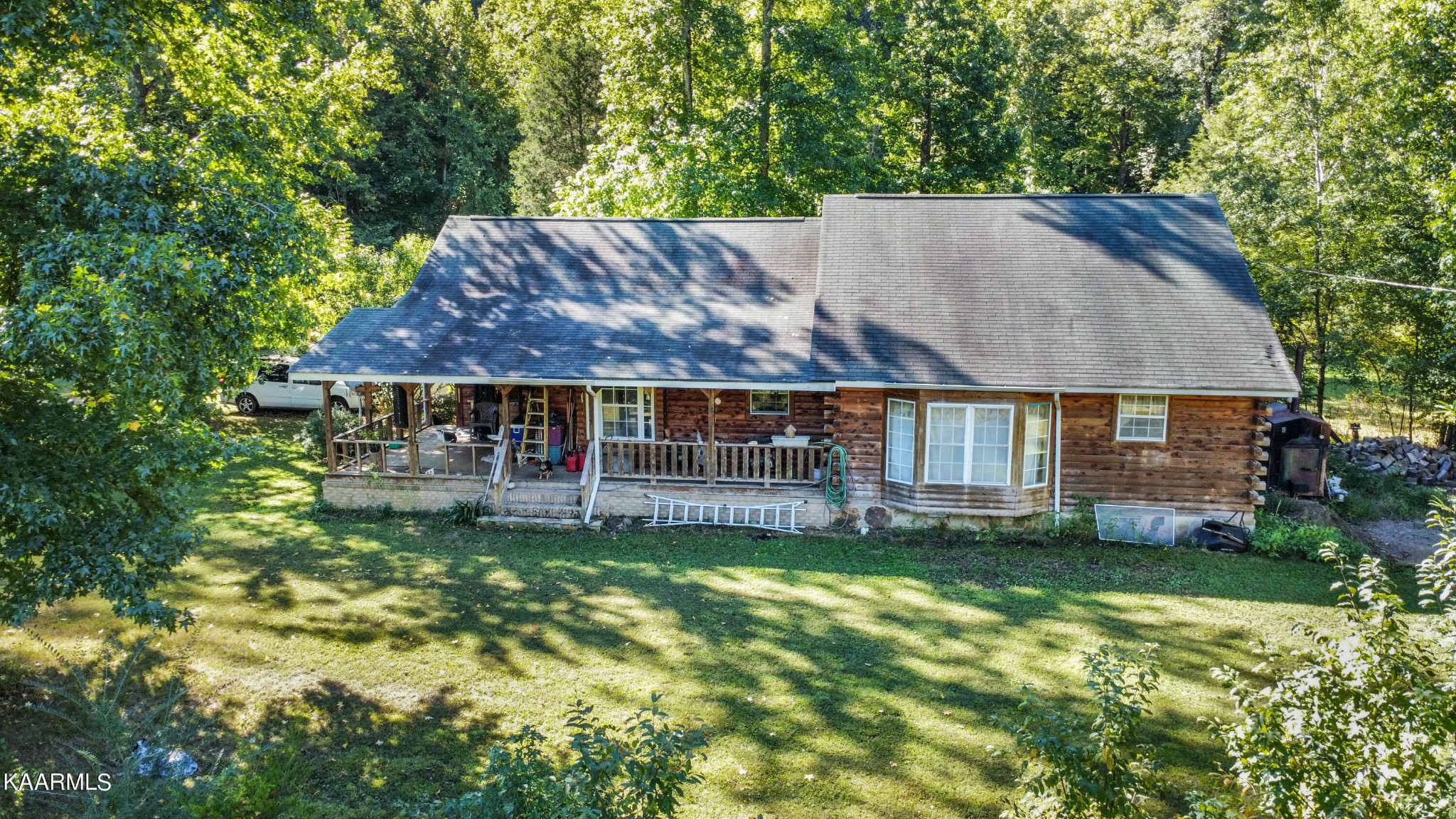 3879 Roan Creek Road Lobelville, TN 37097 - Photo 4 of 45 a view of a house with a garden