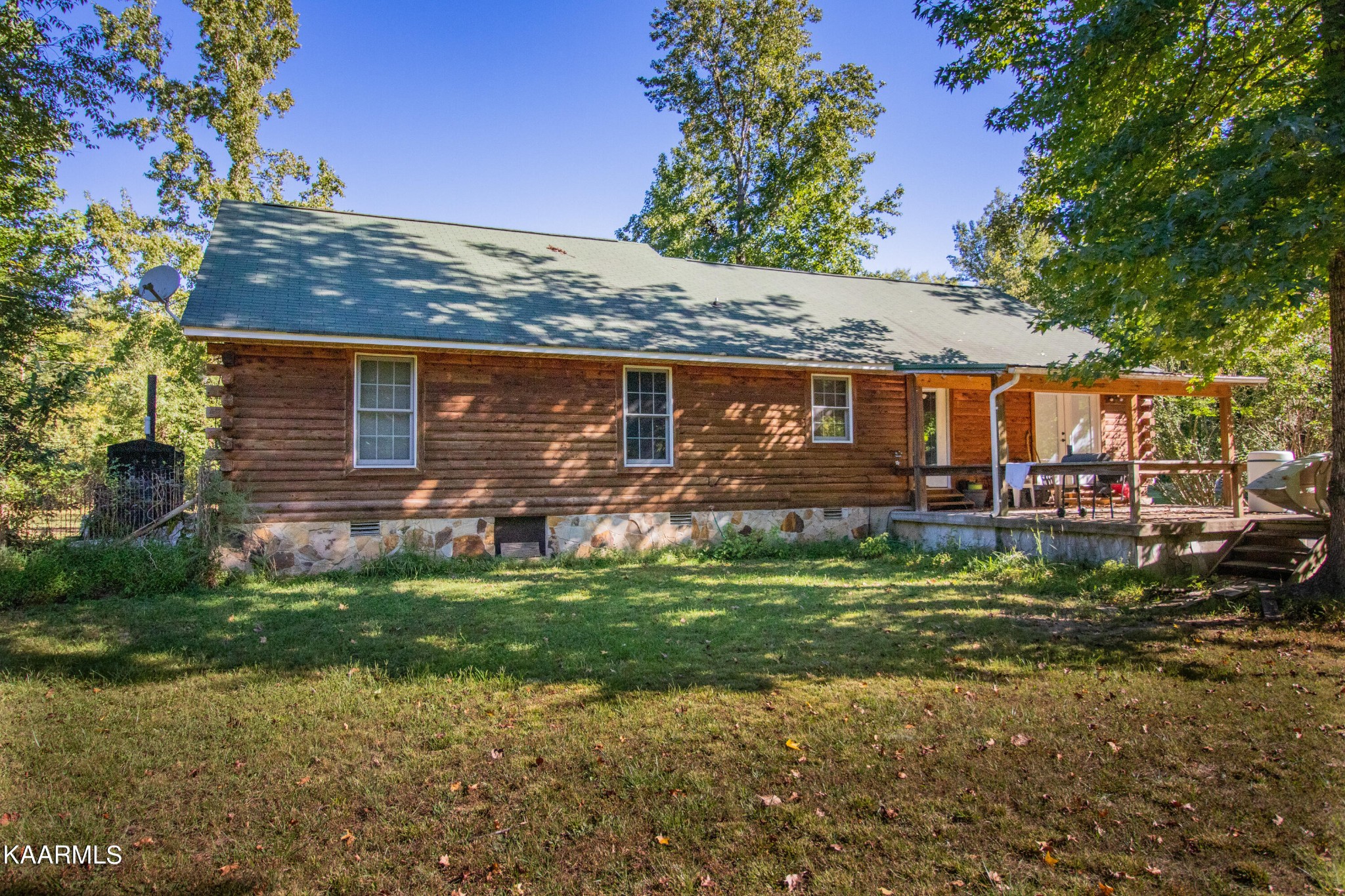 3879 Roan Creek Road Lobelville, TN 37097 - Photo 6 of 45 a view of a house with a yard