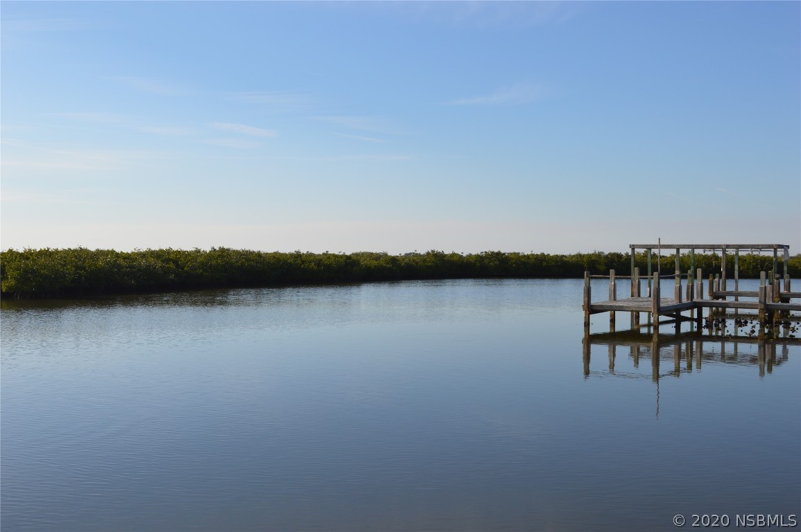6312 River Road New Smyrna Beach, FL 32169 - Photo 8 of 33 a view of lake with table and chair