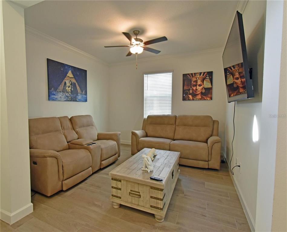17304 Banded Gold Lane Wimauma, FL 33598 - Photo 11 of 44 a living room with furniture and a rug