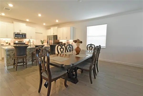 a view of a dining room with furniture