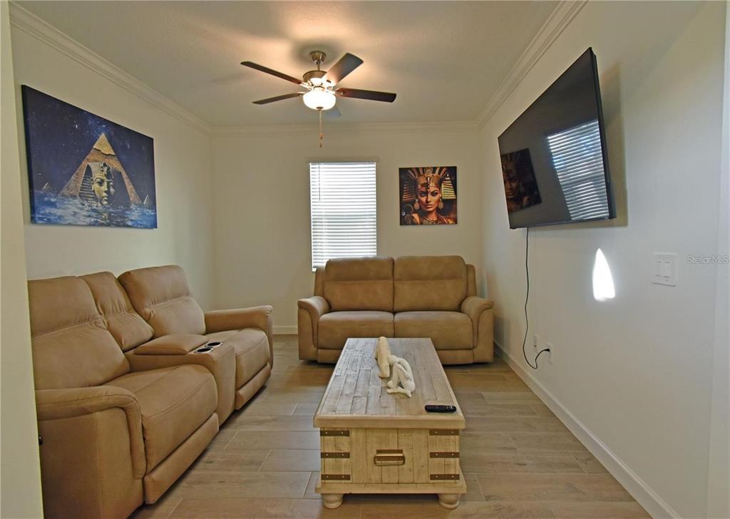 17304 Banded Gold Lane Wimauma, FL 33598 - Photo 25 of 44 a living room with furniture and a couch