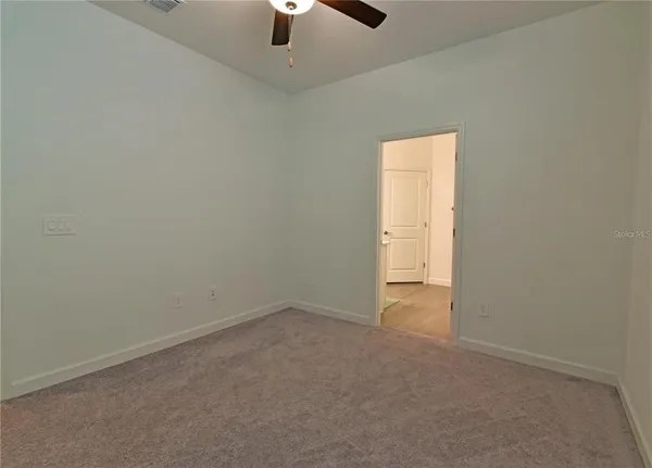 an empty room with a empty space and a window