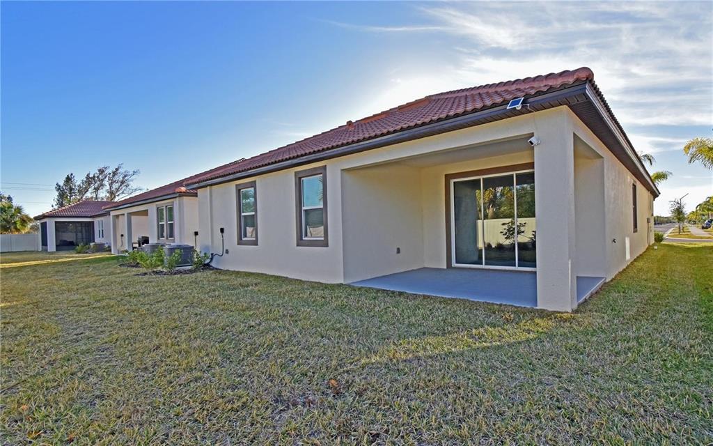 17304 Banded Gold Lane Wimauma, FL 33598 - Photo 7 of 44 a view of a house with a yard