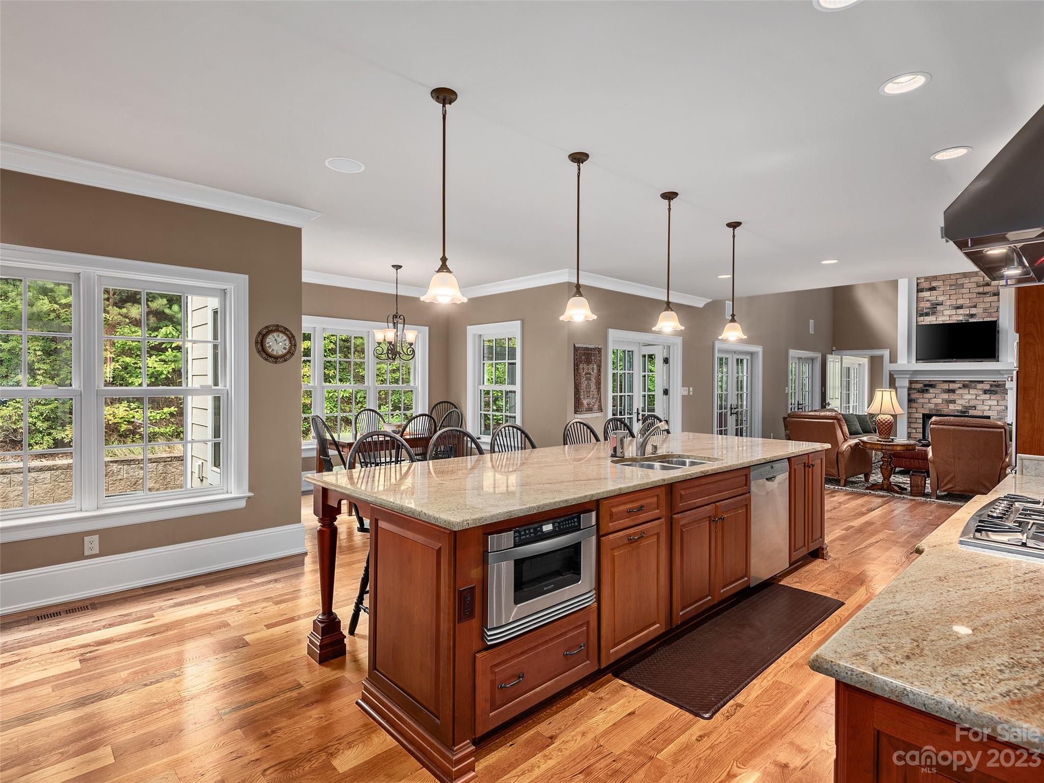 113 Willow Farm Road Fairview, NC 28730 - Photo 11 of 48 a kitchen with stainless steel appliances granite countertop a stove and a wooden floors