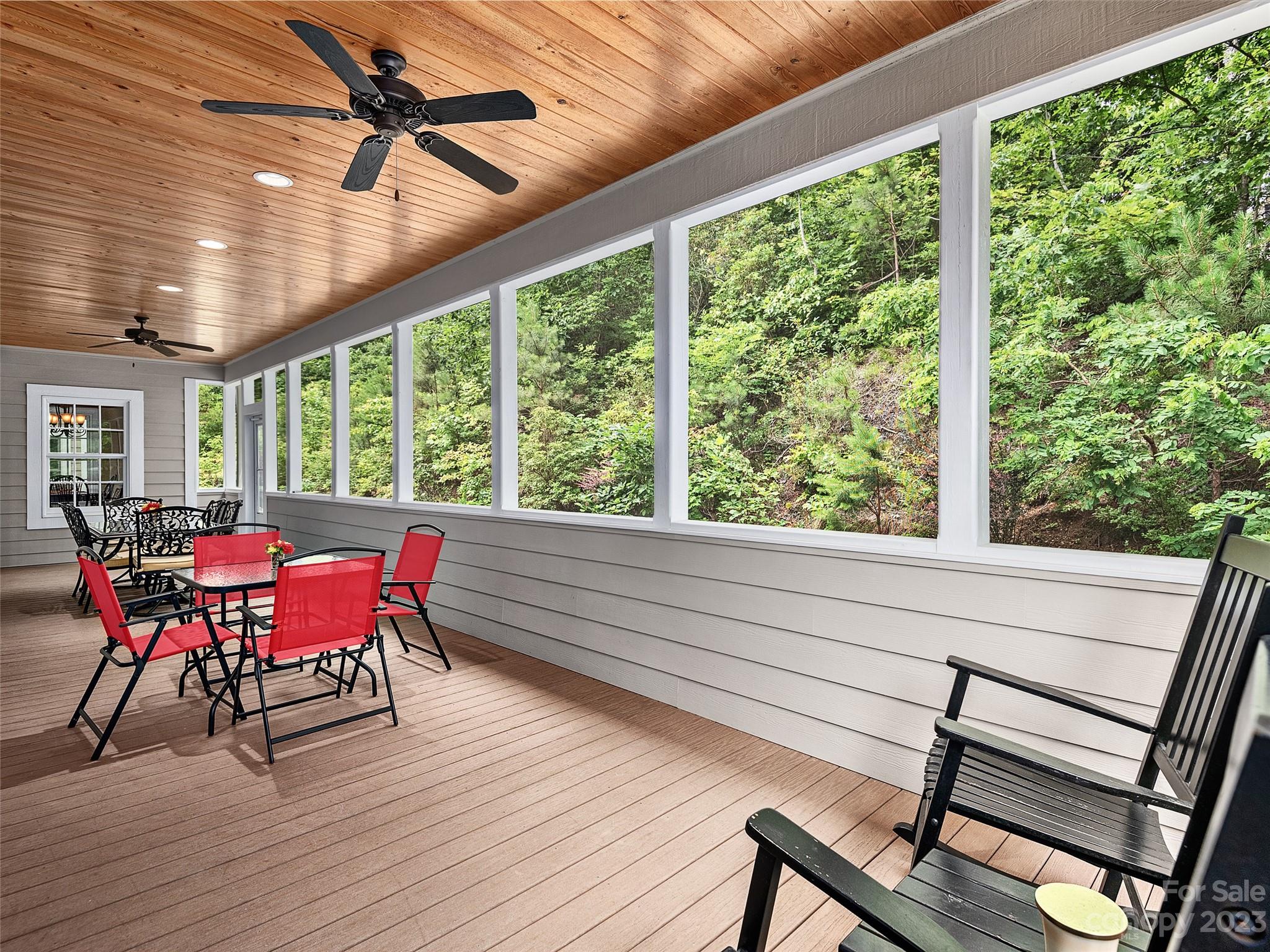113 Willow Farm Road Fairview, NC 28730 - Photo 15 of 48 a view of a dining room with furniture window and wooden floor