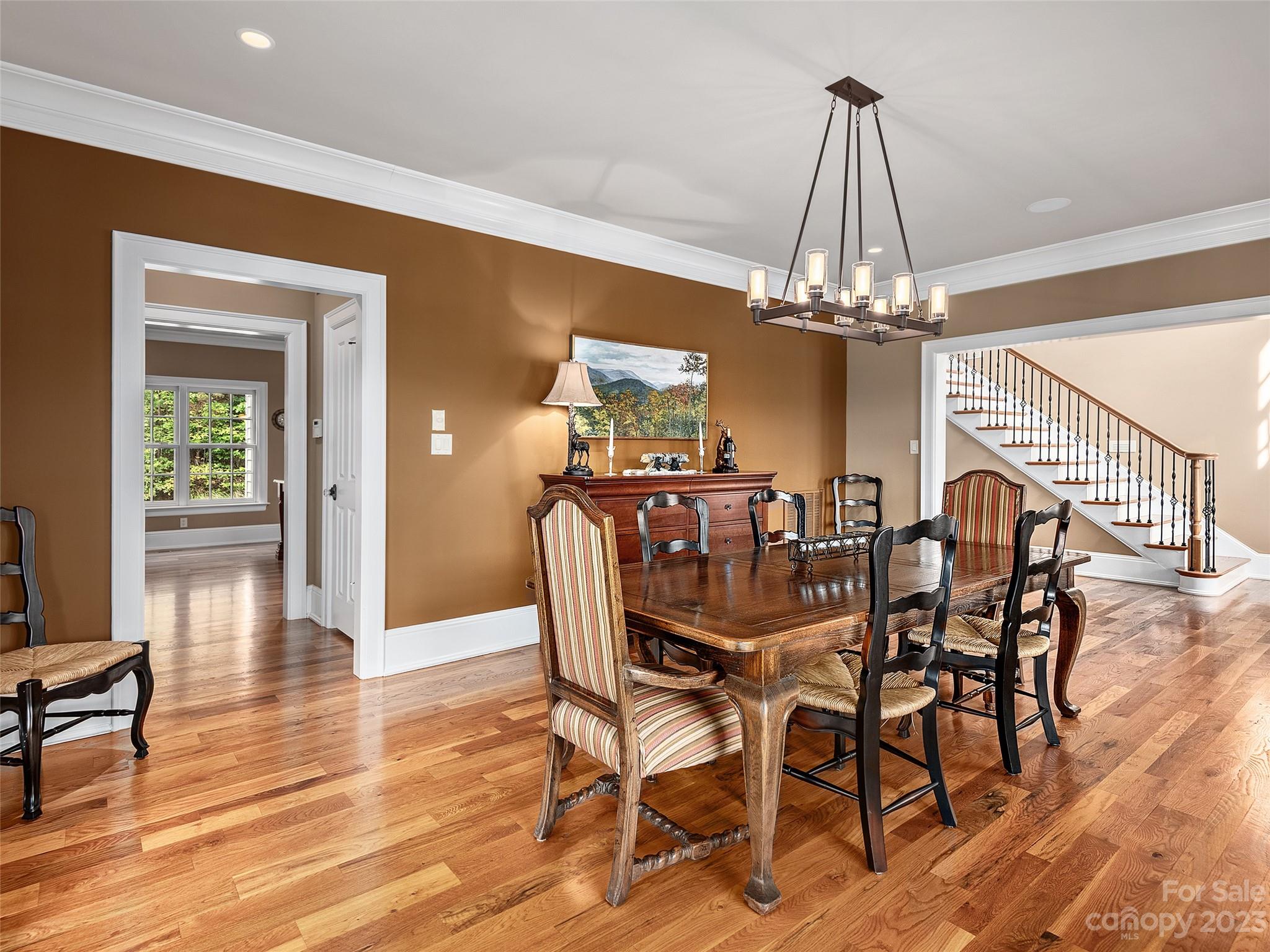 113 Willow Farm Road Fairview, NC 28730 - Photo 17 of 48 a view of a dining room with furniture and chandelier