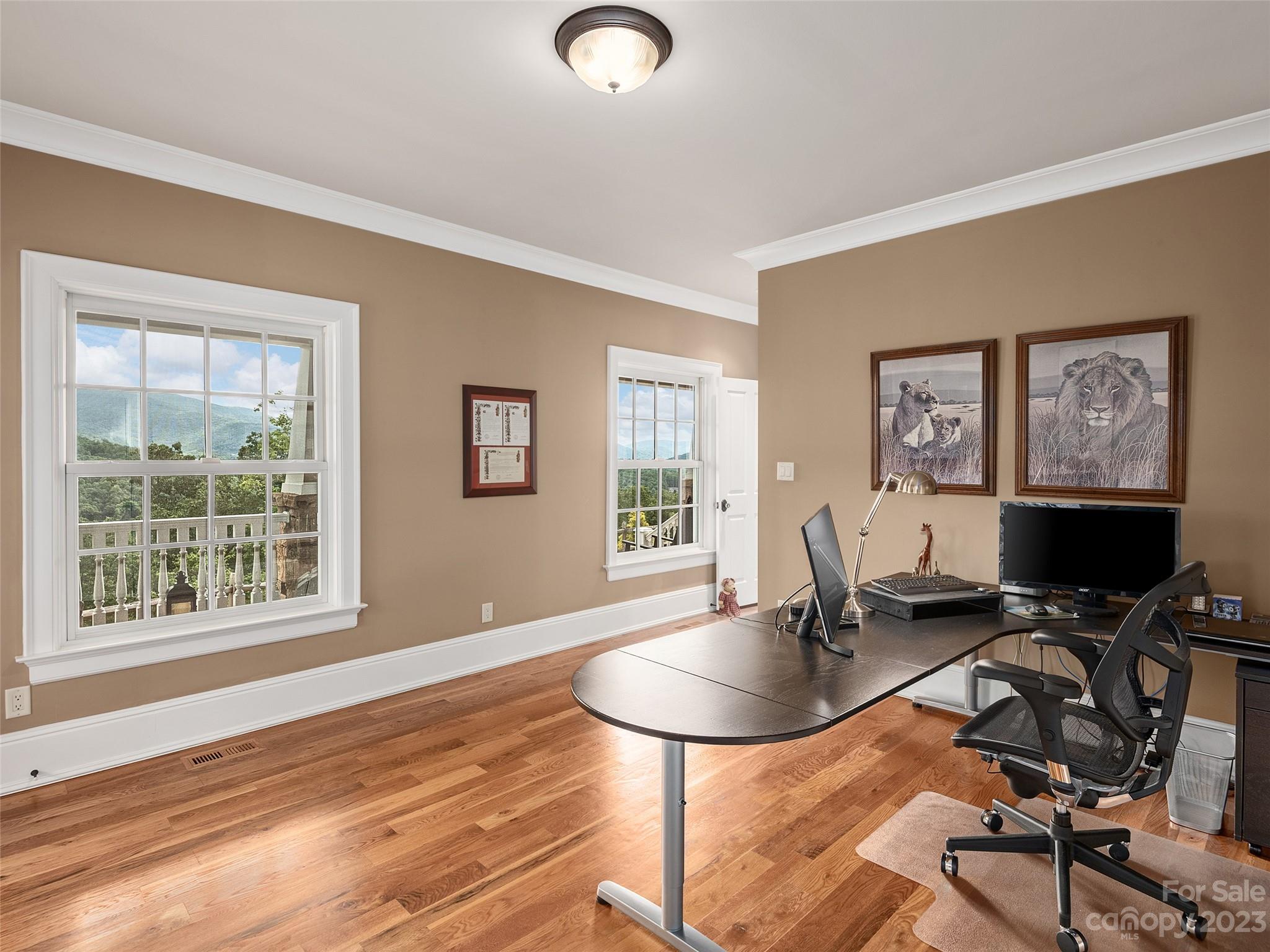 113 Willow Farm Road Fairview, NC 28730 - Photo 19 of 48 a view of a workspace with furniture and a window