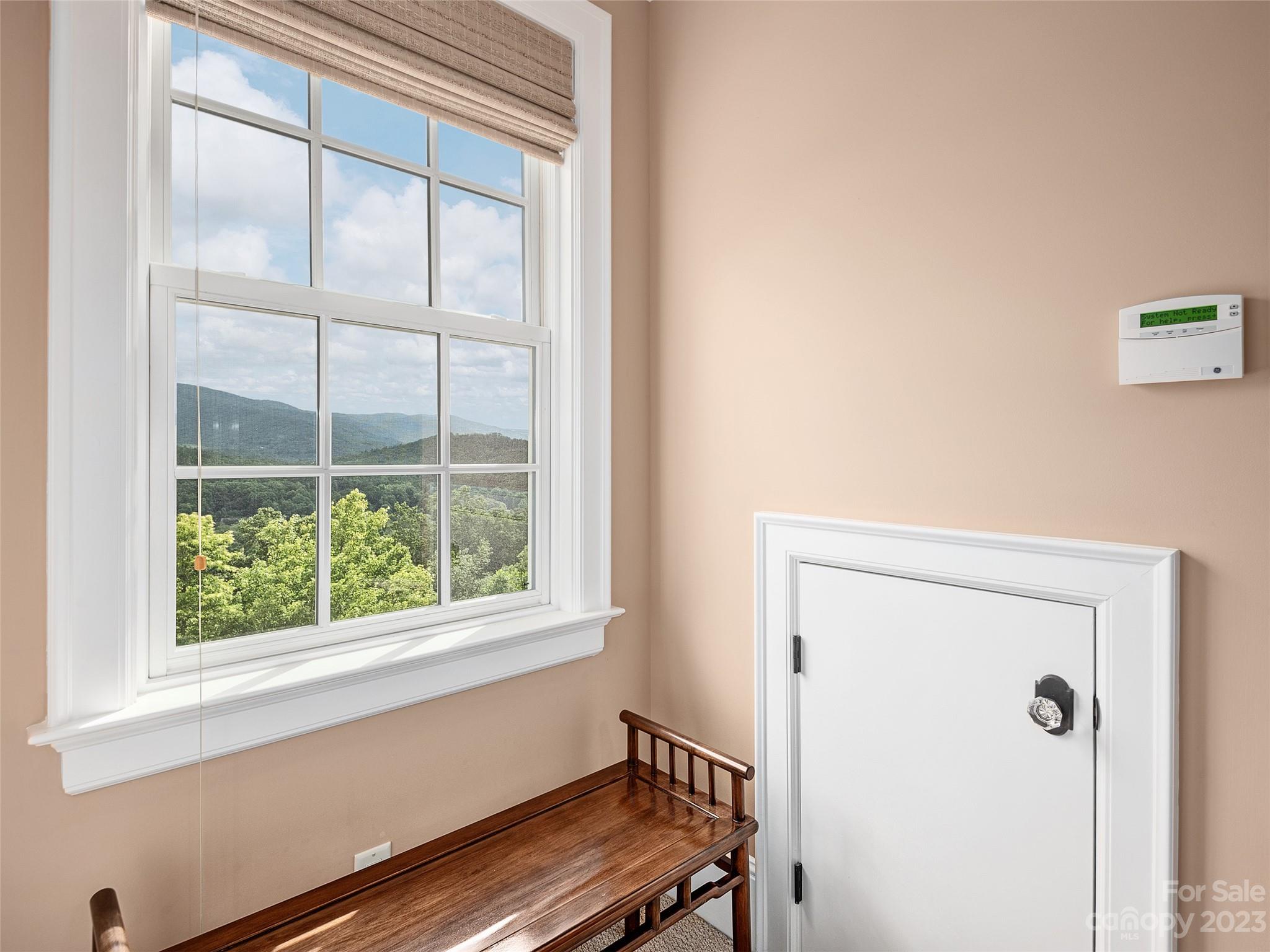 113 Willow Farm Road Fairview, NC 28730 - Photo 25 of 48 a view of a room that has a window and a refrigerator