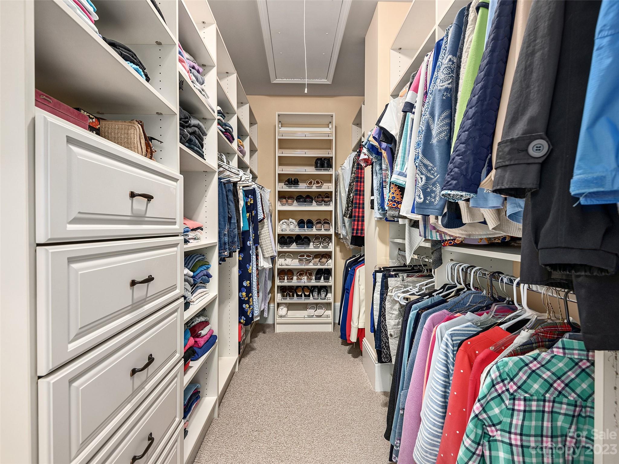 113 Willow Farm Road Fairview, NC 28730 - Photo 27 of 48 a view of walk in closet with clothes and shoes