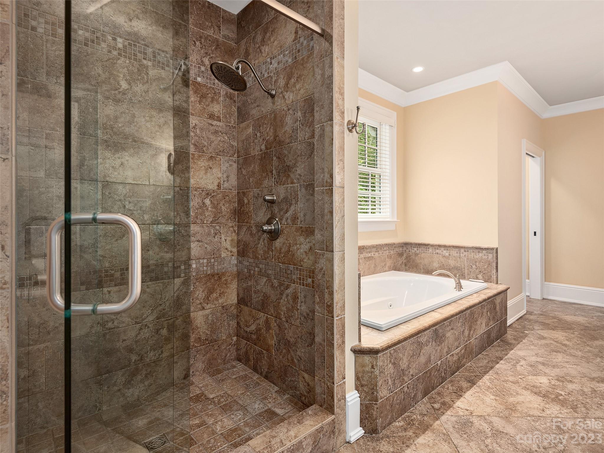 113 Willow Farm Road Fairview, NC 28730 - Photo 28 of 48 a bathroom with a tub a sink and shower