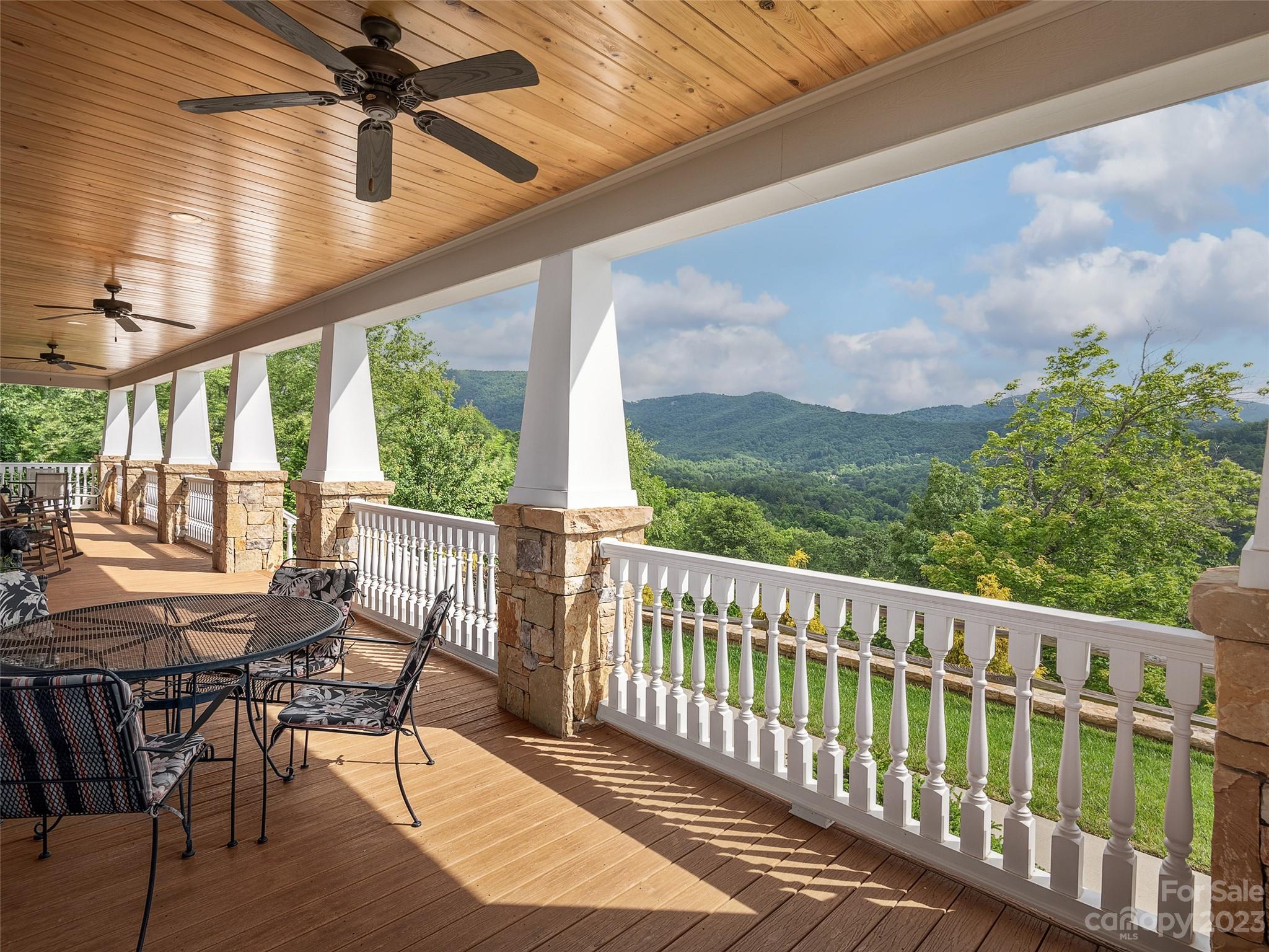 113 Willow Farm Road Fairview, NC 28730 - Photo 3 of 48 a view of a chairs and table in the balcony