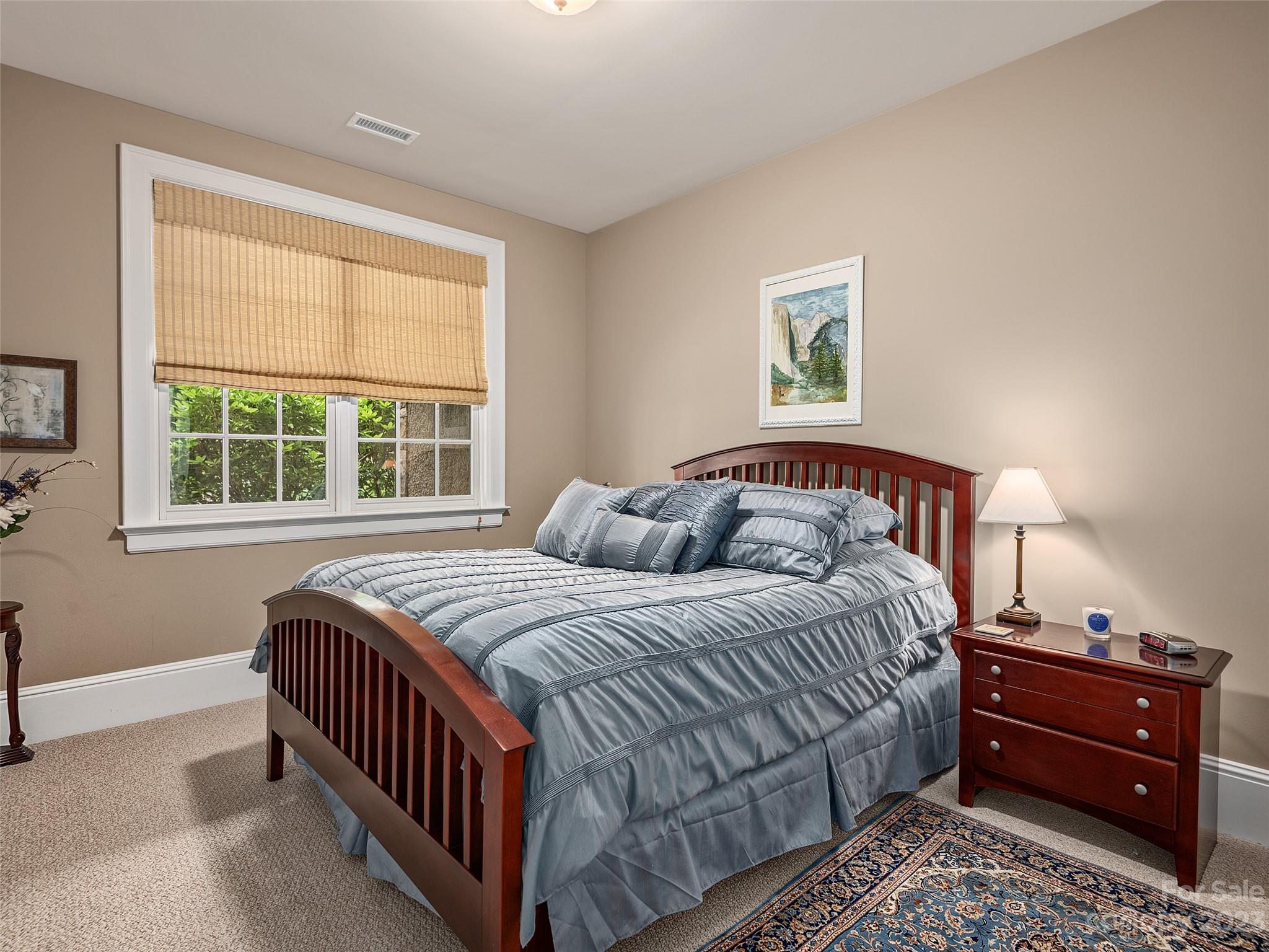 113 Willow Farm Road Fairview, NC 28730 - Photo 32 of 48 a bedroom with a bed and a window