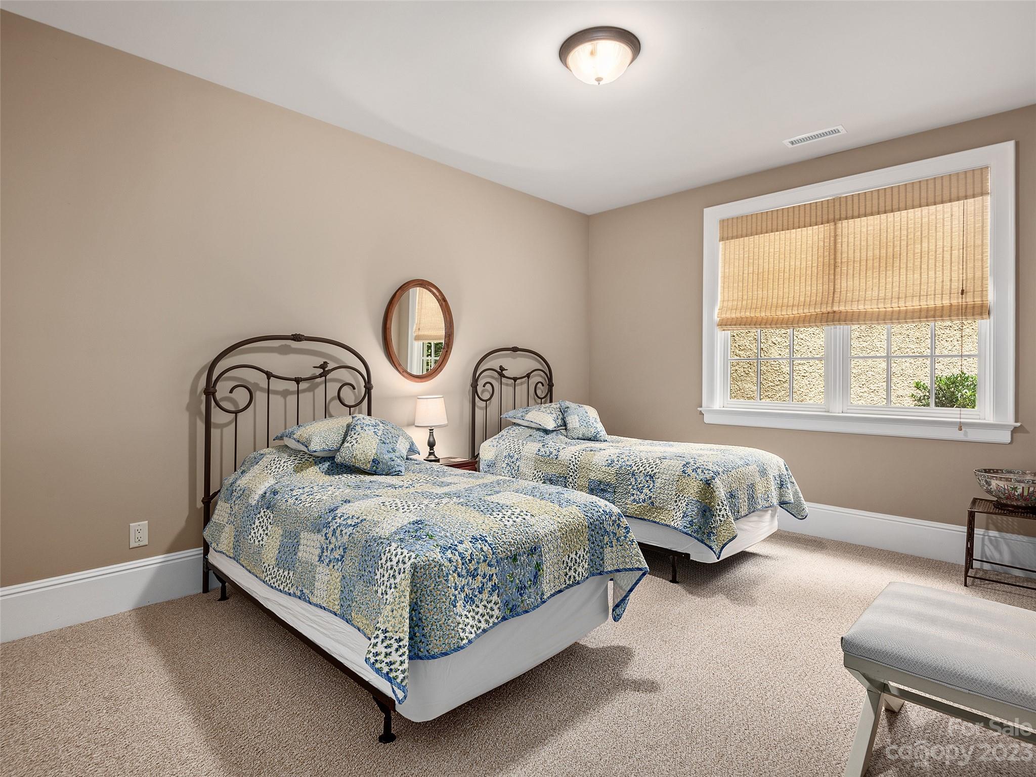 113 Willow Farm Road Fairview, NC 28730 - Photo 40 of 48 a bedroom with bed and a window