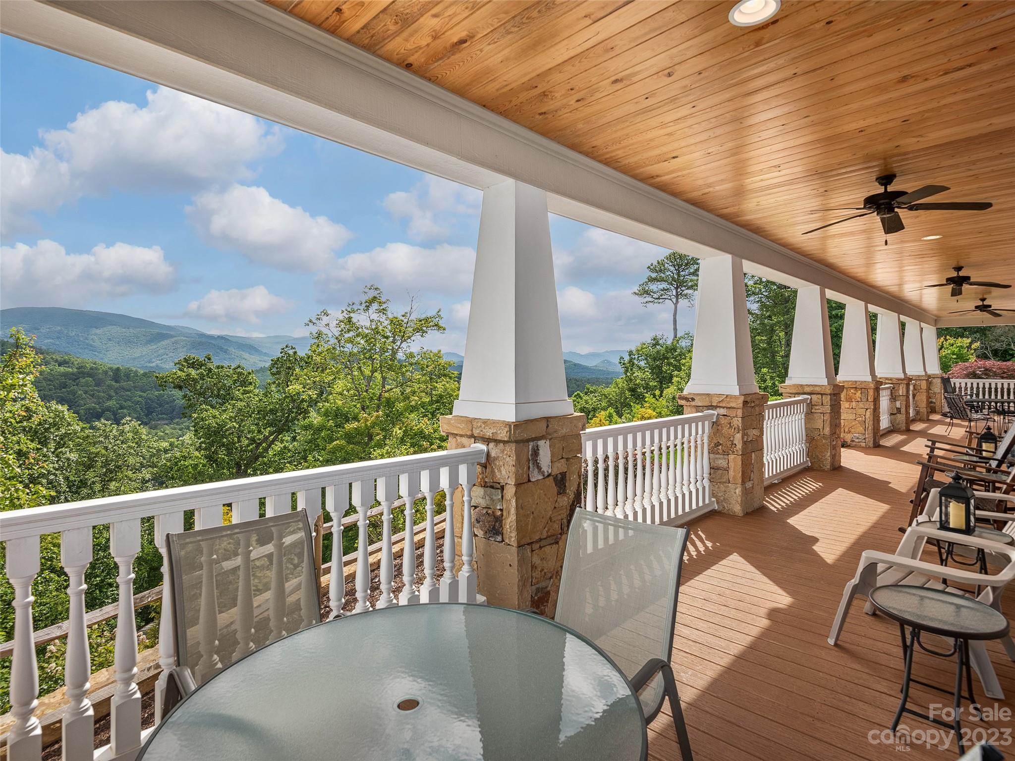 113 Willow Farm Road Fairview, NC 28730 - Photo 4 of 48 a view of a chair and tables in the balcony
