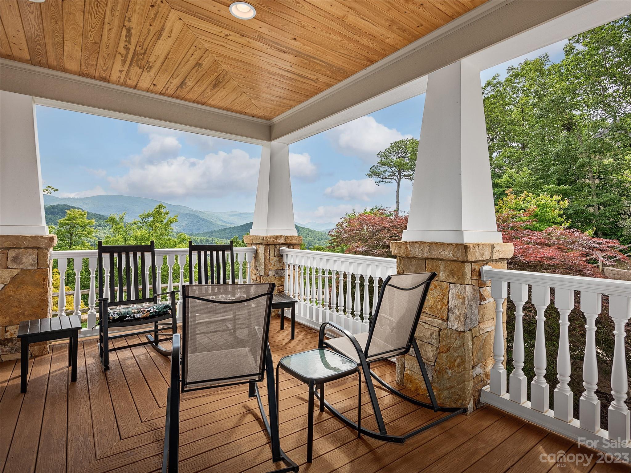 113 Willow Farm Road Fairview, NC 28730 - Photo 46 of 48 a view of a chairs on wooden deck