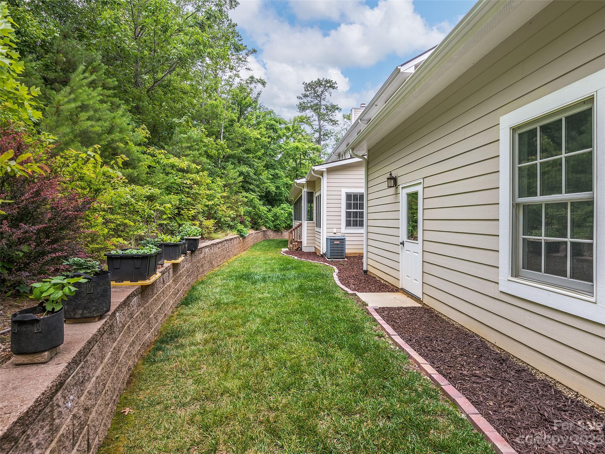 113 Willow Farm Road Fairview, NC 28730 - Photo 47 of 48 a view of a backyard with plants and large trees