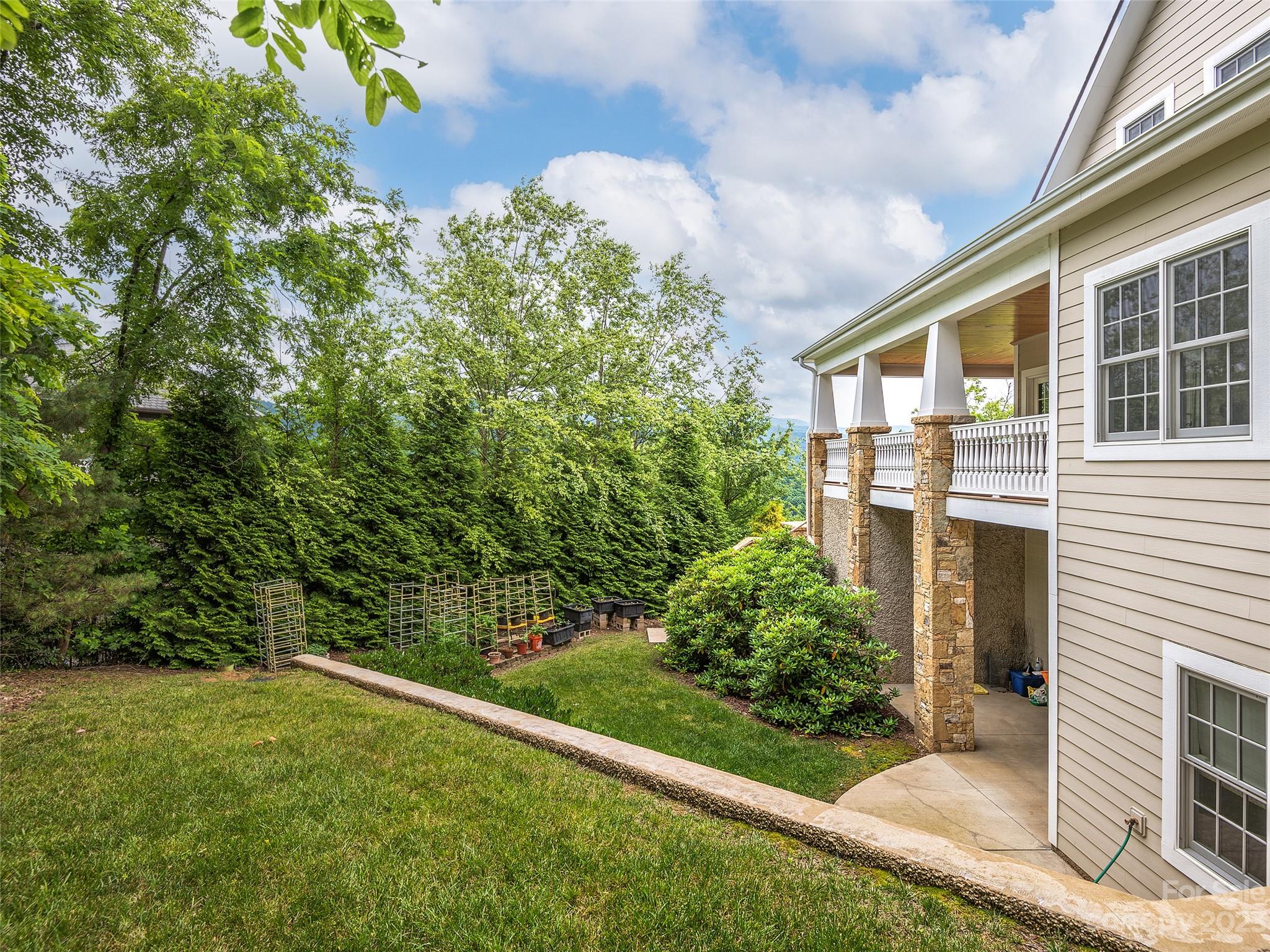 113 Willow Farm Road Fairview, NC 28730 - Photo 48 of 48 a front view of a house with a yard