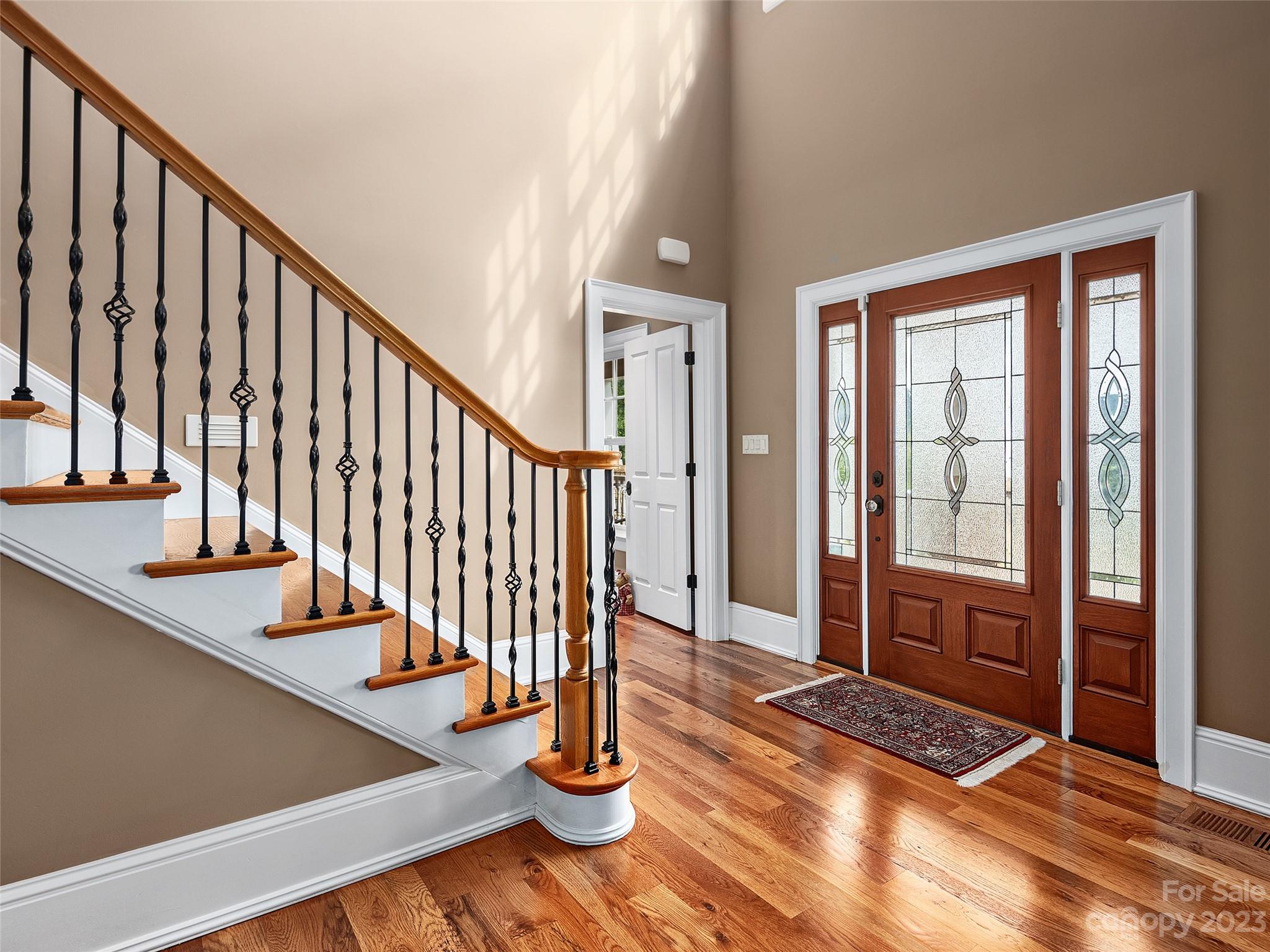 113 Willow Farm Road Fairview, NC 28730 - Photo 5 of 48 a view of an entryway with wooden floor and door