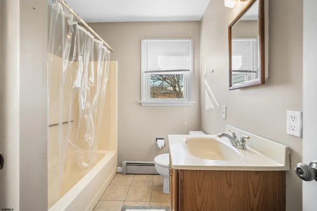 a bathroom with a sink a mirror and a bathtub