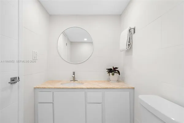 a bathroom with a sink a toilet and bathtub
