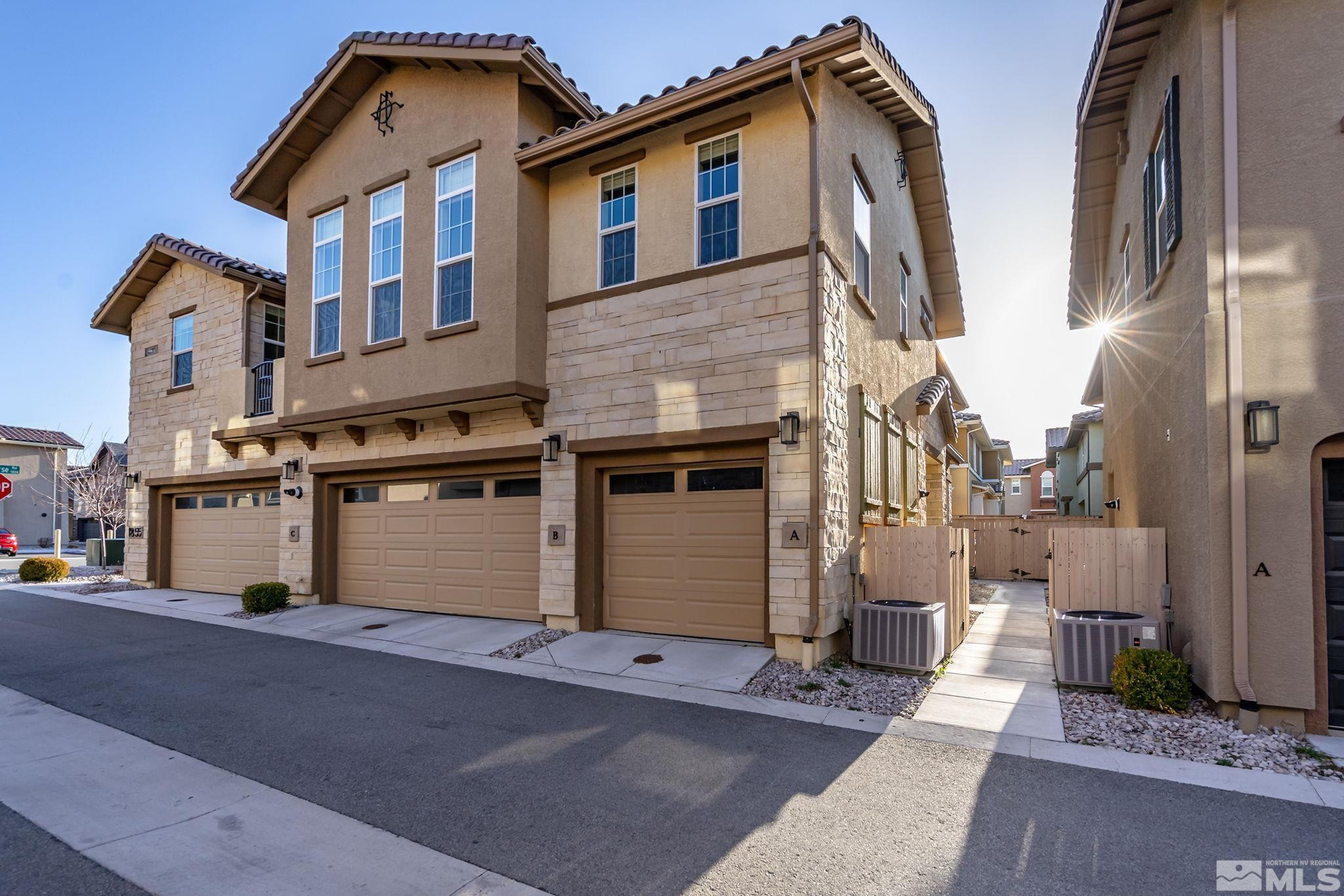 1855 Sea Horse Road, Unit A Reno, NV 89521 - Photo 1 of 32 a front view of a house with a garage
