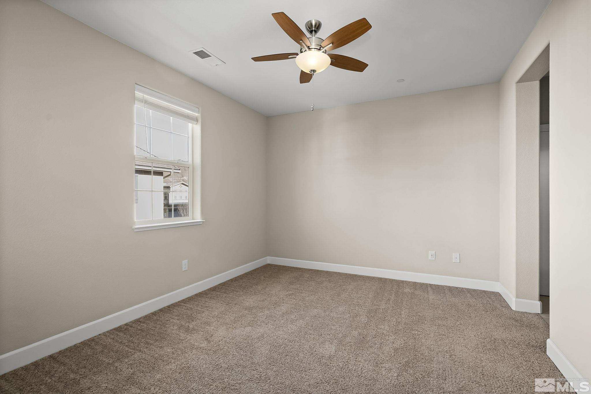 1855 Sea Horse Road, Unit A Reno, NV 89521 - Photo 11 of 32 a view of a big room with carpet
