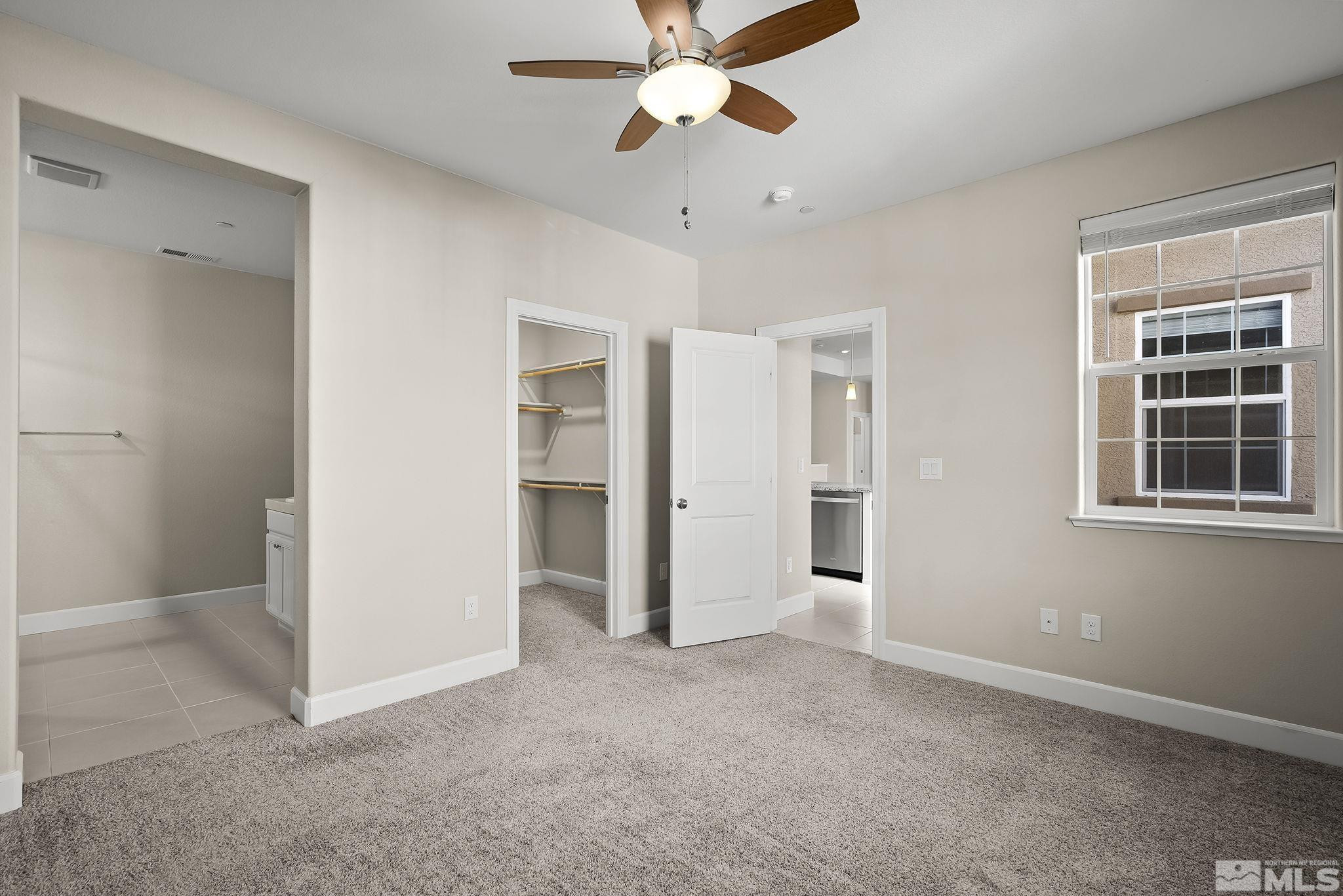 1855 Sea Horse Road, Unit A Reno, NV 89521 - Photo 12 of 32 a view of empty room with window and ceiling fan