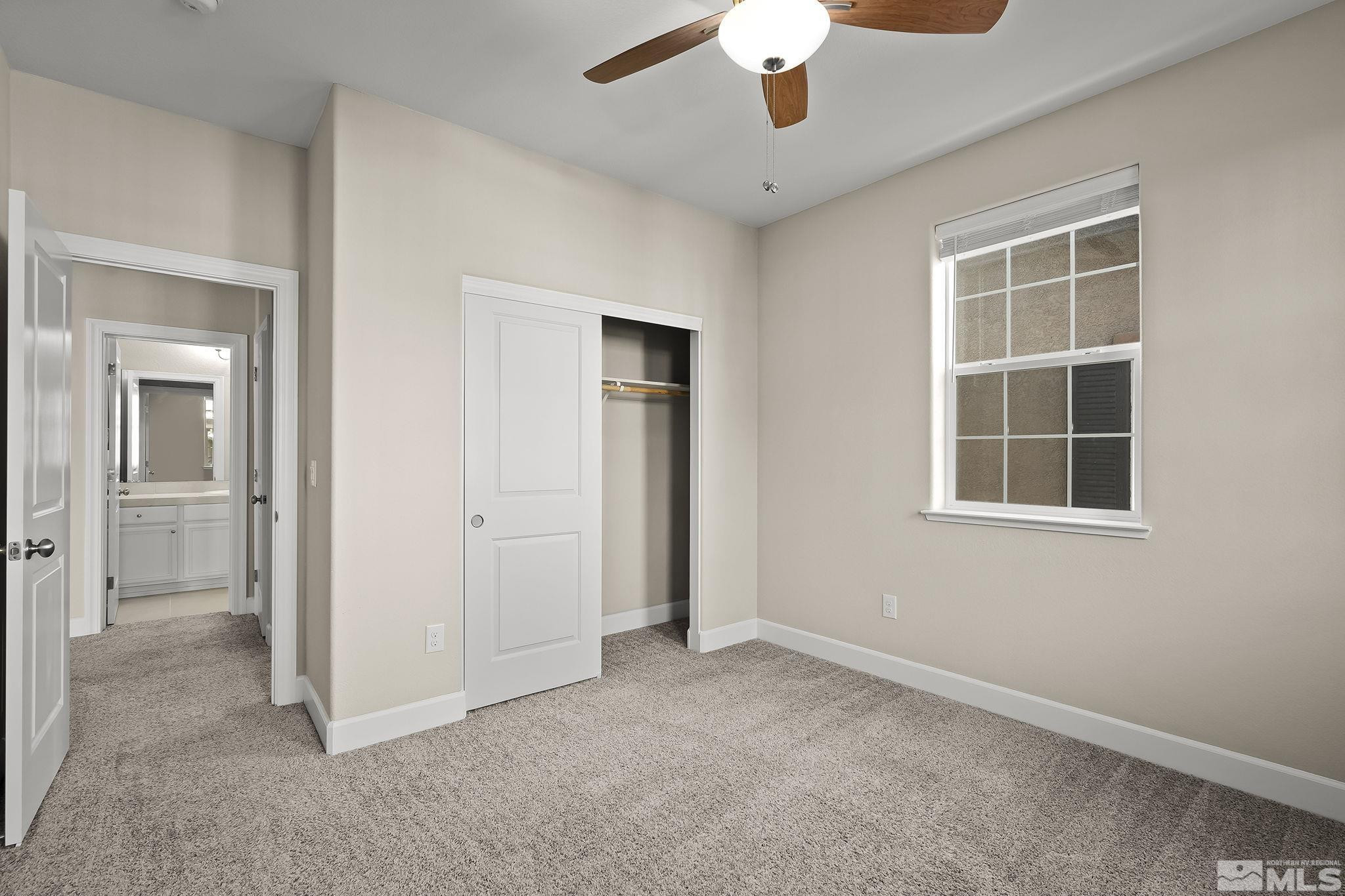 1855 Sea Horse Road, Unit A Reno, NV 89521 - Photo 16 of 32 an empty room with a empty space and windows