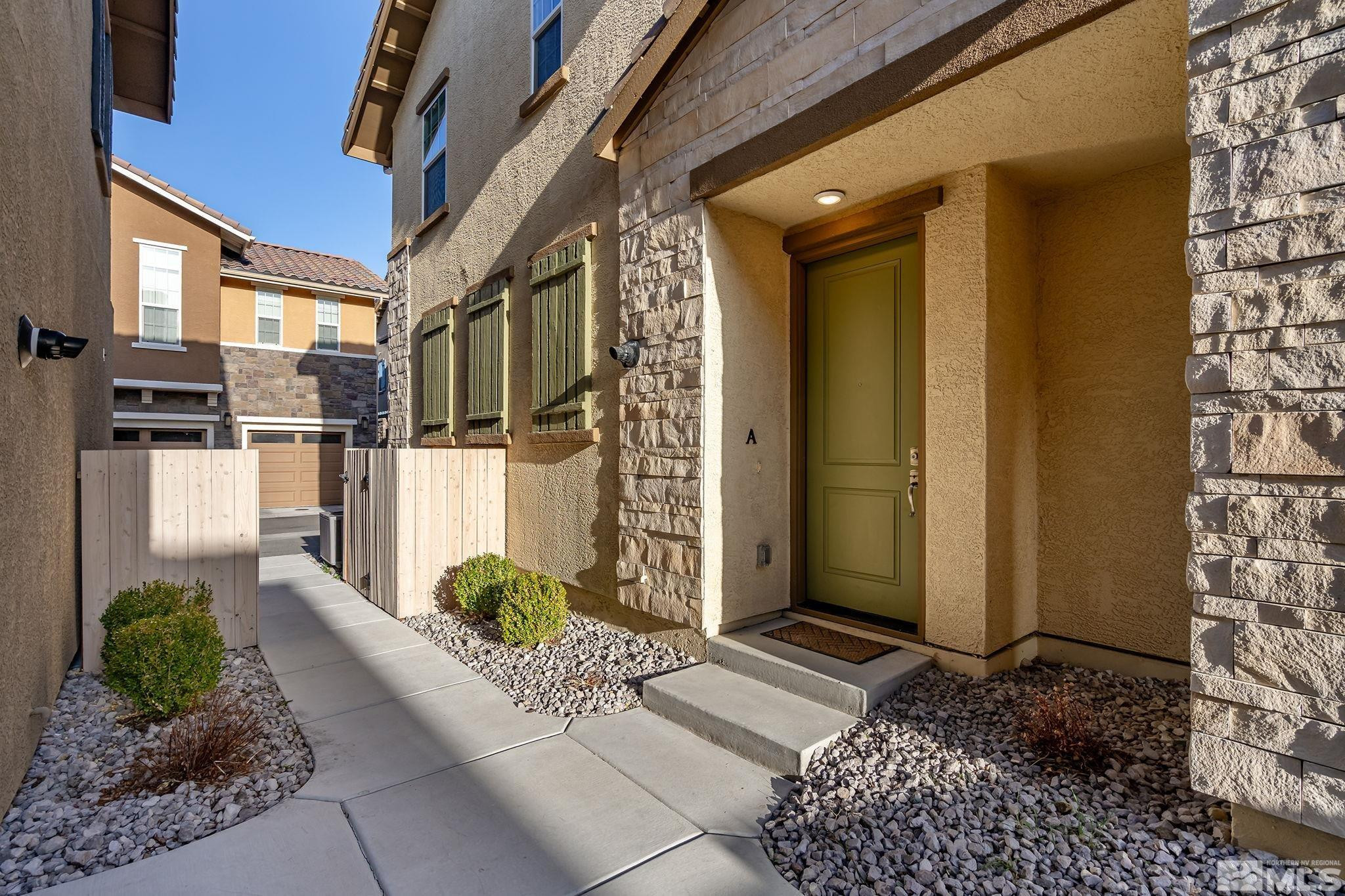 1855 Sea Horse Road, Unit A Reno, NV 89521 - Photo 2 of 32 a view of a entryway door front of house