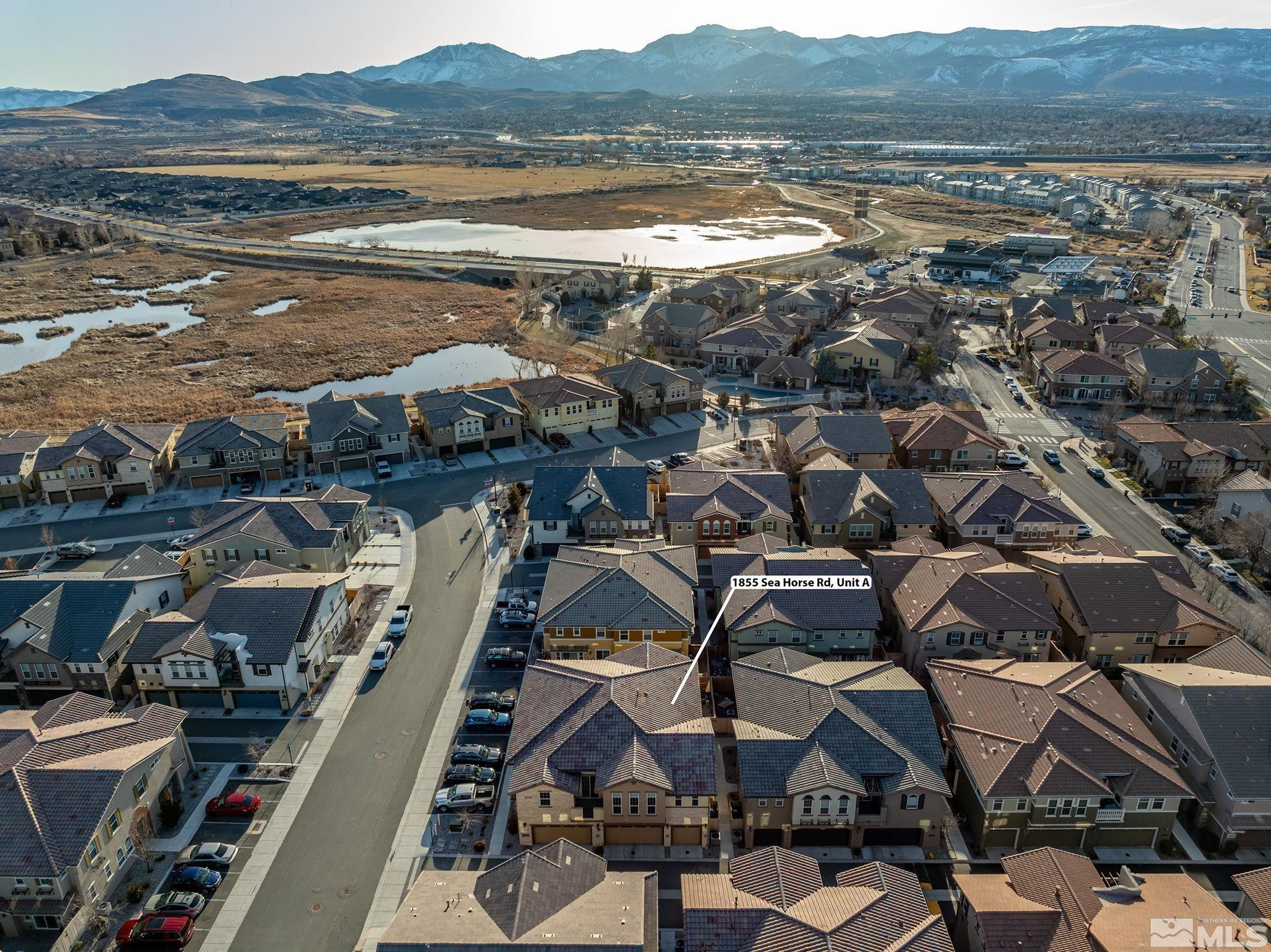 1855 Sea Horse Road, Unit A Reno, NV 89521 - Photo 23 of 32 an aerial view of residential building and lake view